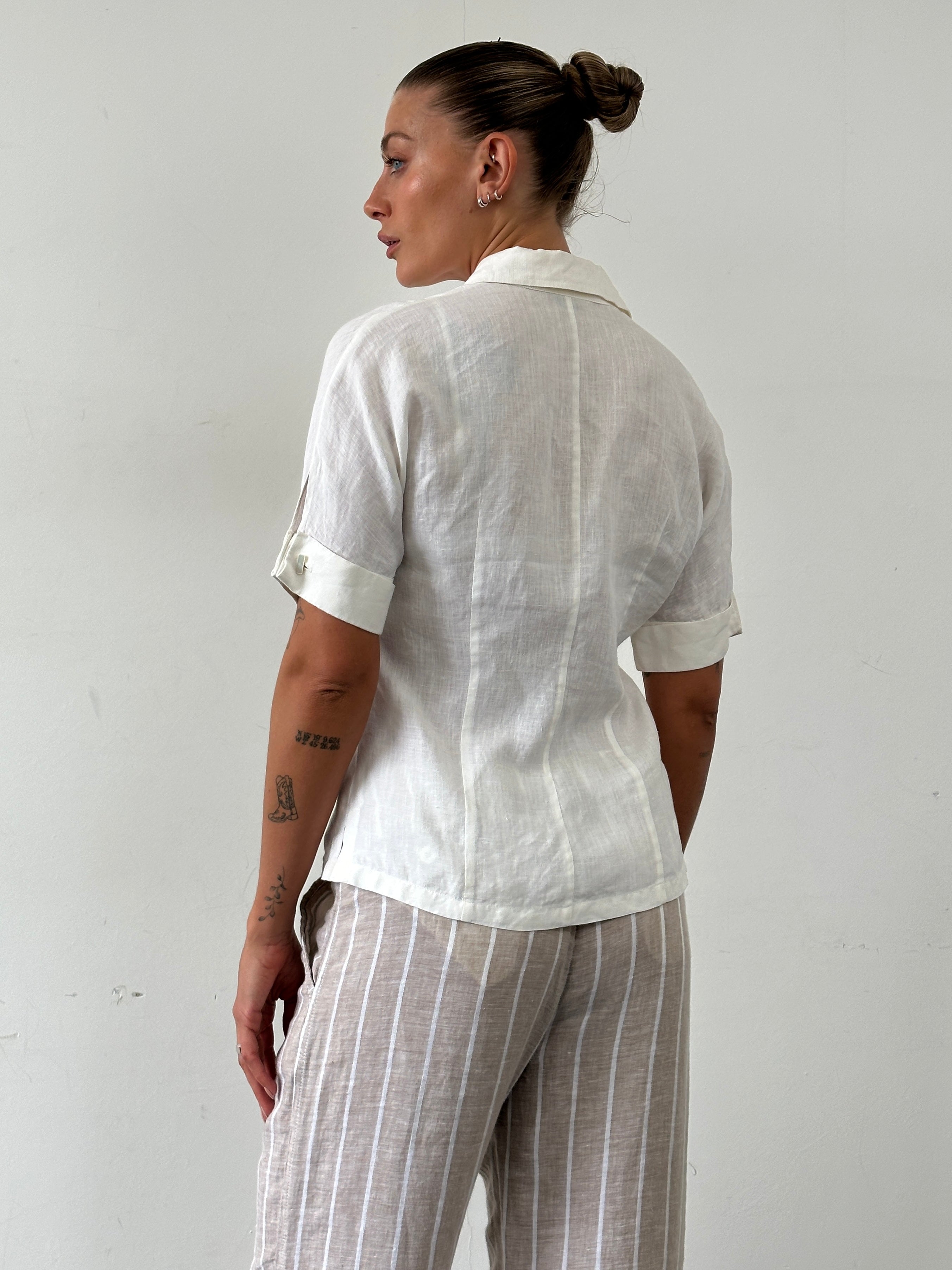 Max Mara pure linen short sleeve shirt in white, lightweight and breathable, displayed on a neutral background.
