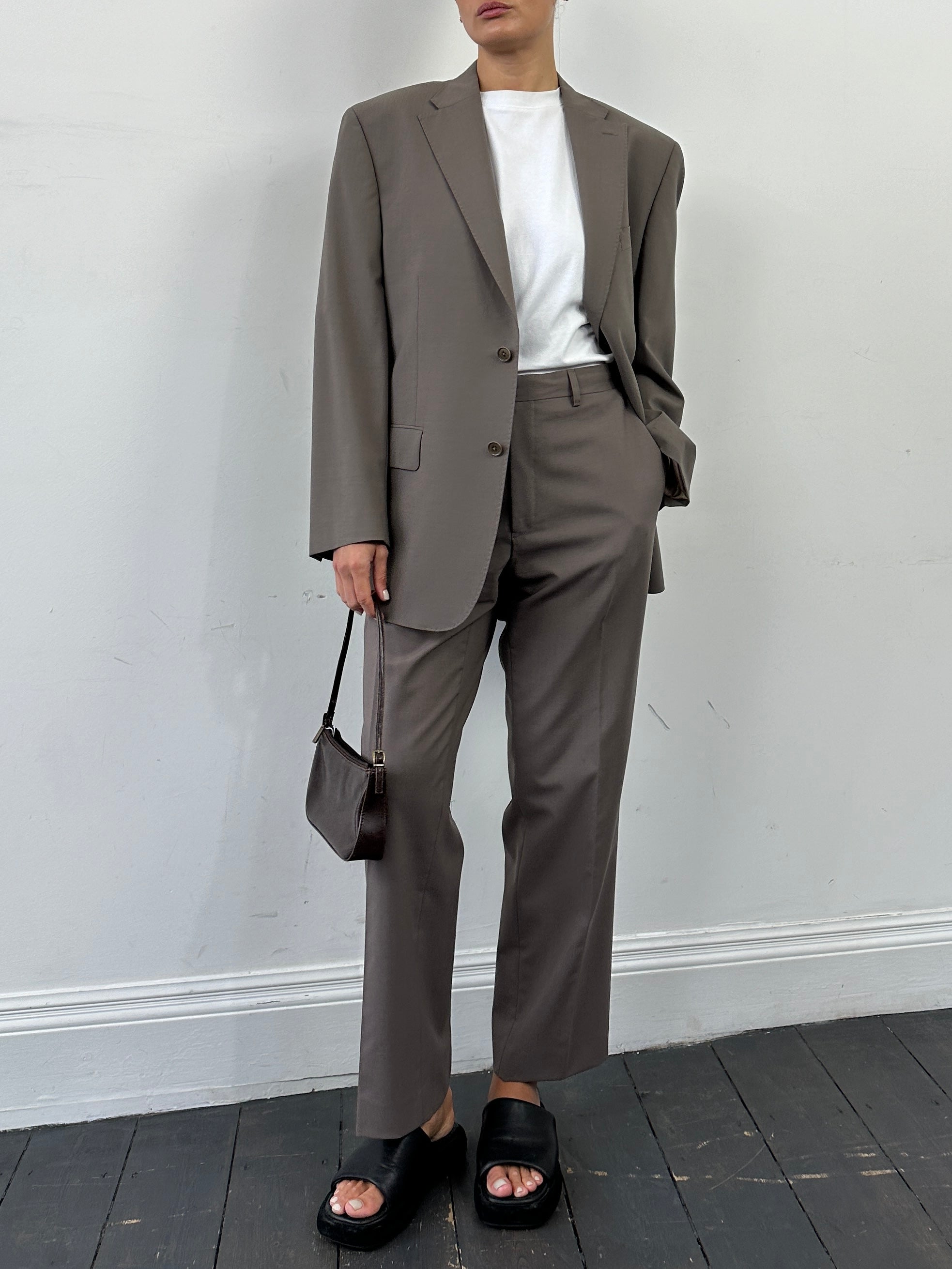 Vintage wool single-breasted jumpsuit in size 42S/W34, featuring a classic tailored design and vintage style.