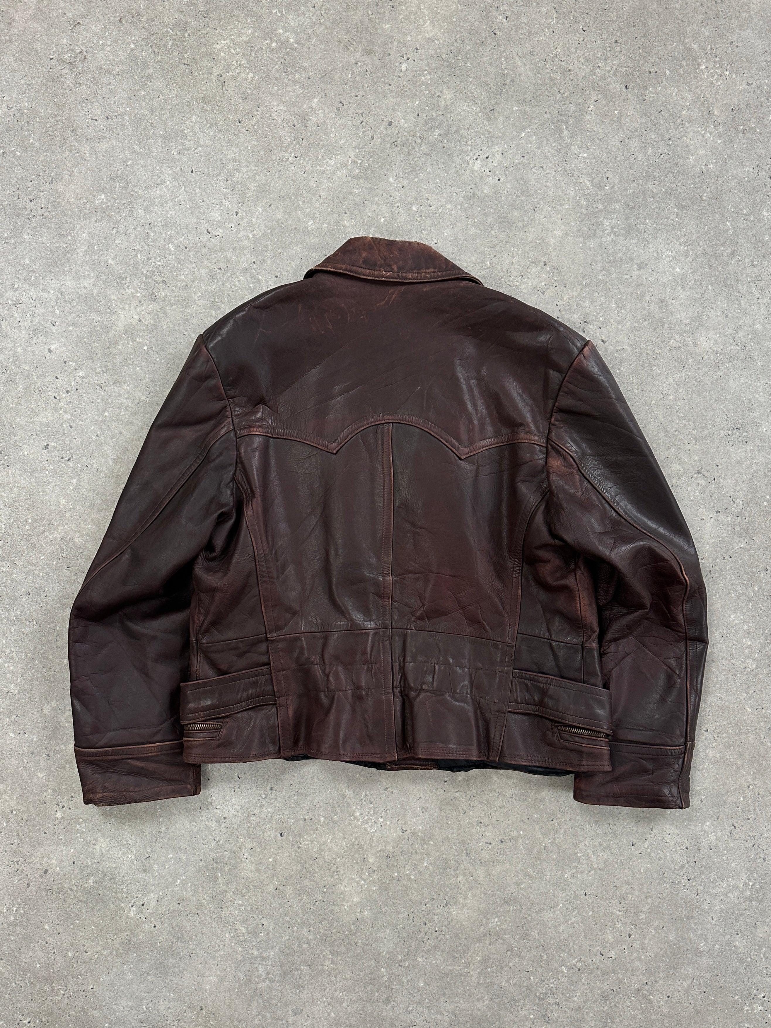 Vintage 1980s distressed leather biker jacket in size L/XL, featuring rugged design and classic motorcycle style.