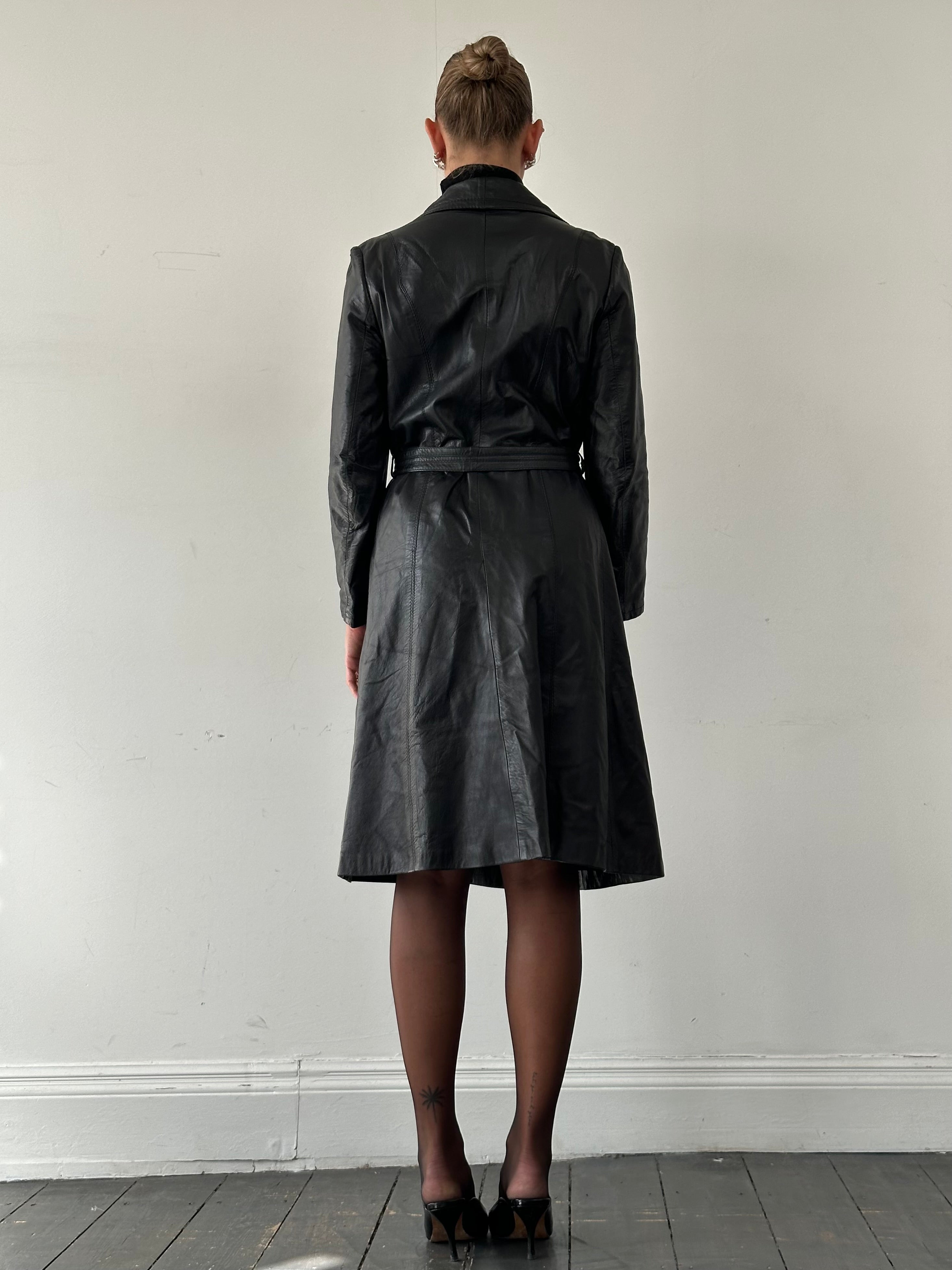 Vintage Italian leather belted trench coat in size M, featuring classic design and detailed stitching.