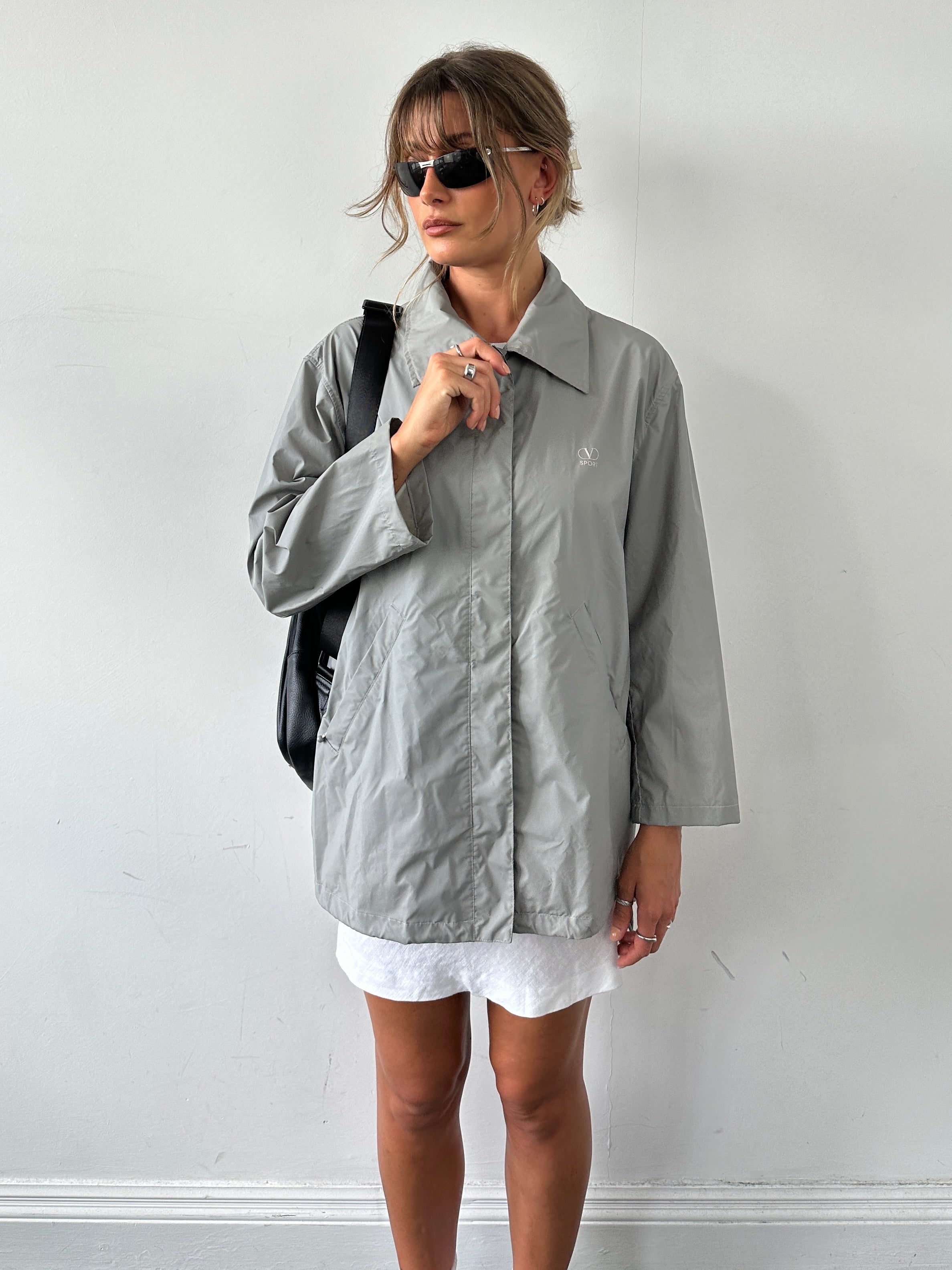 Valentino Sport raincoat jacket in size large, shown with a sleek design and lightweight waterproof fabric.