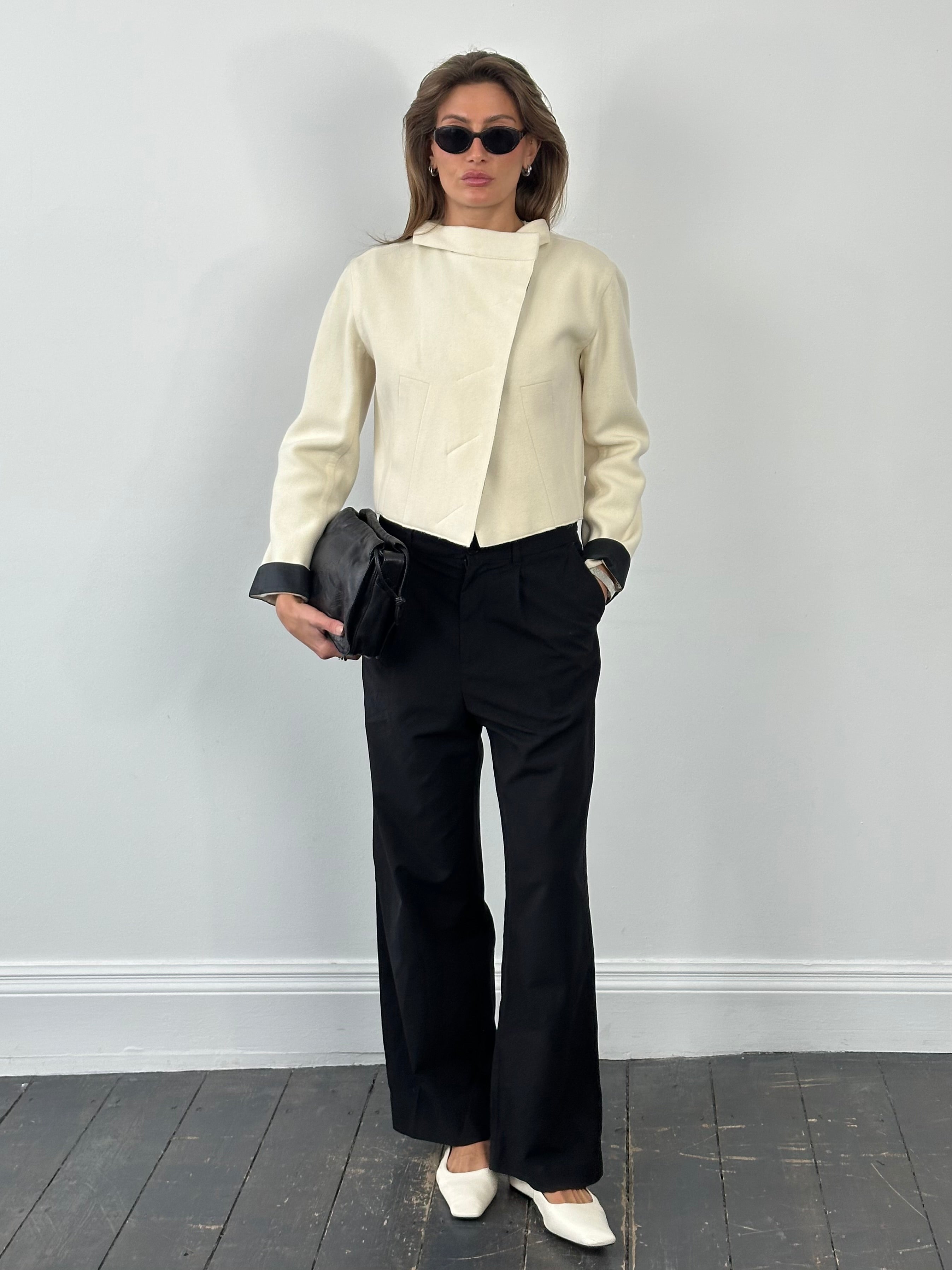 Donna Karan 2000s pure wool cropped jacket in black, tailored design with a sleek collar and long sleeves.