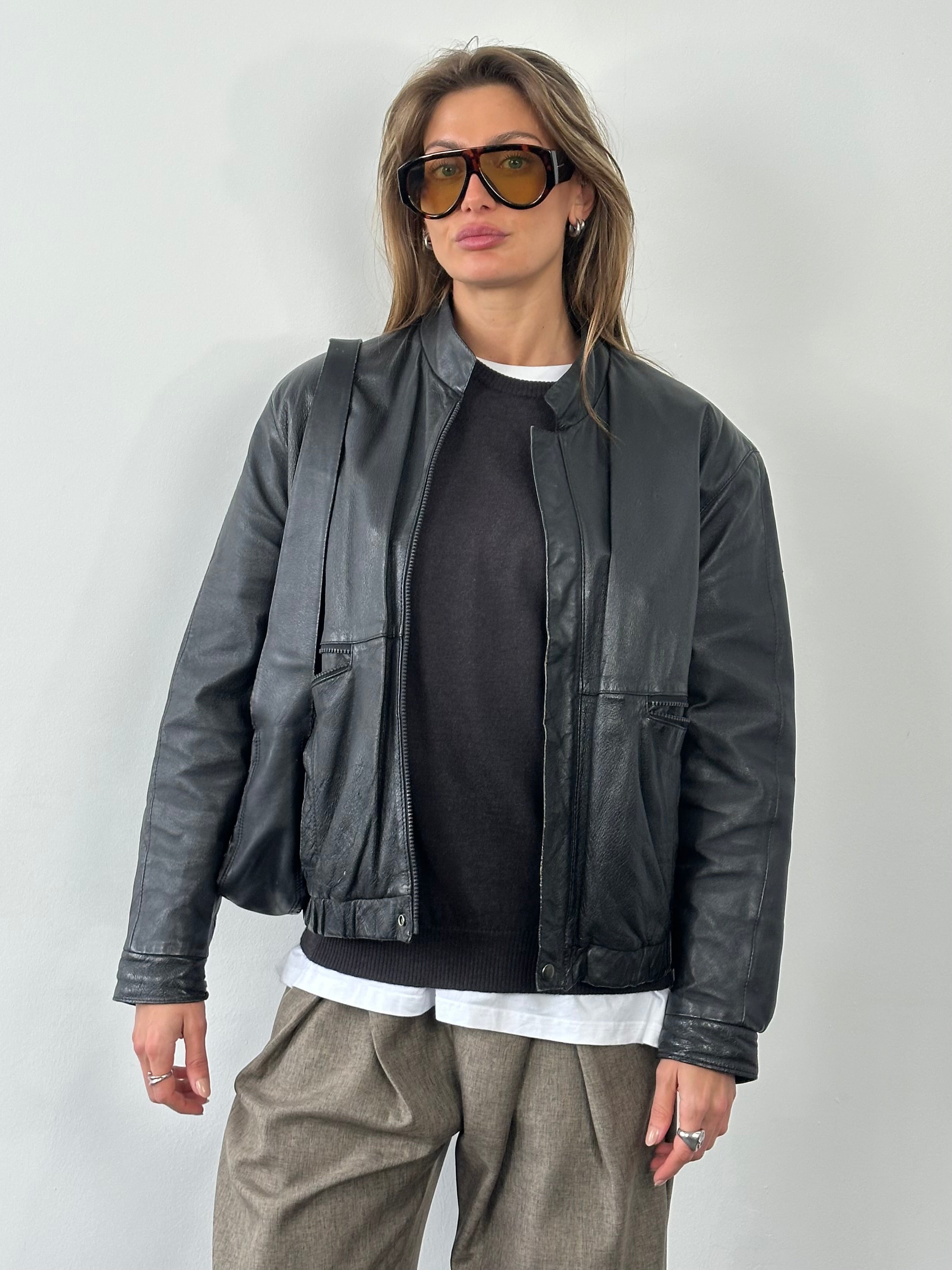 Vintage 1990s Leather Bomber Jacket in medium size, featuring classic design and aged leather details.