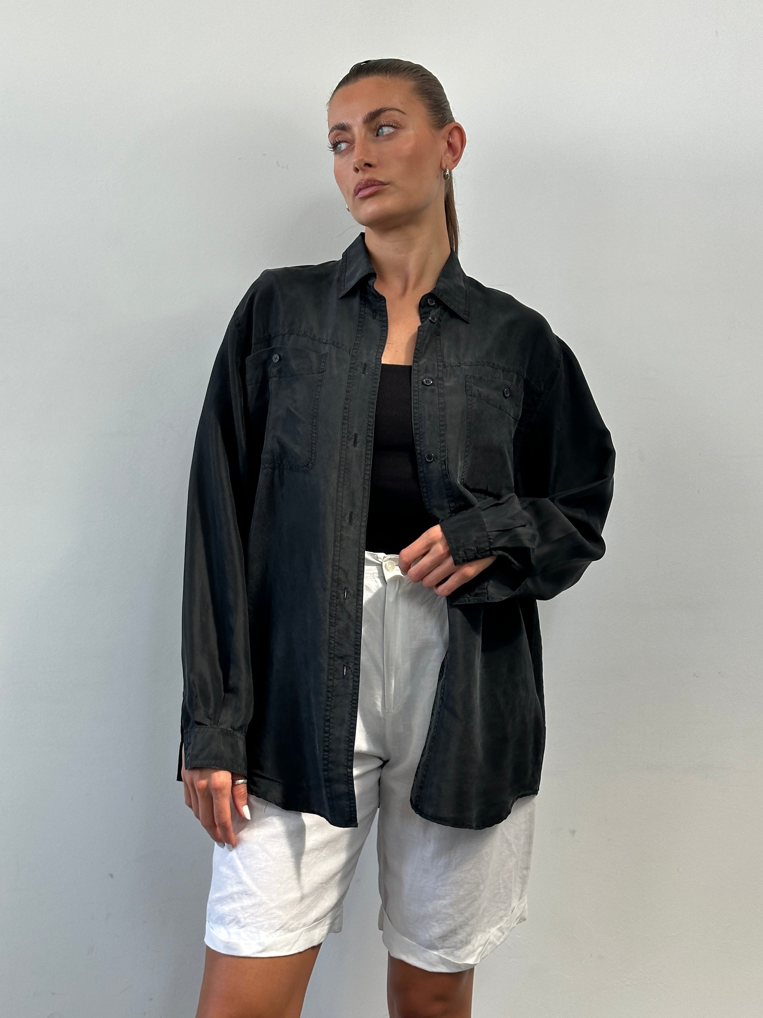 Vintage pure silk shirt in size L/XL, featuring a classic design with a smooth, shiny fabric and button-down front.