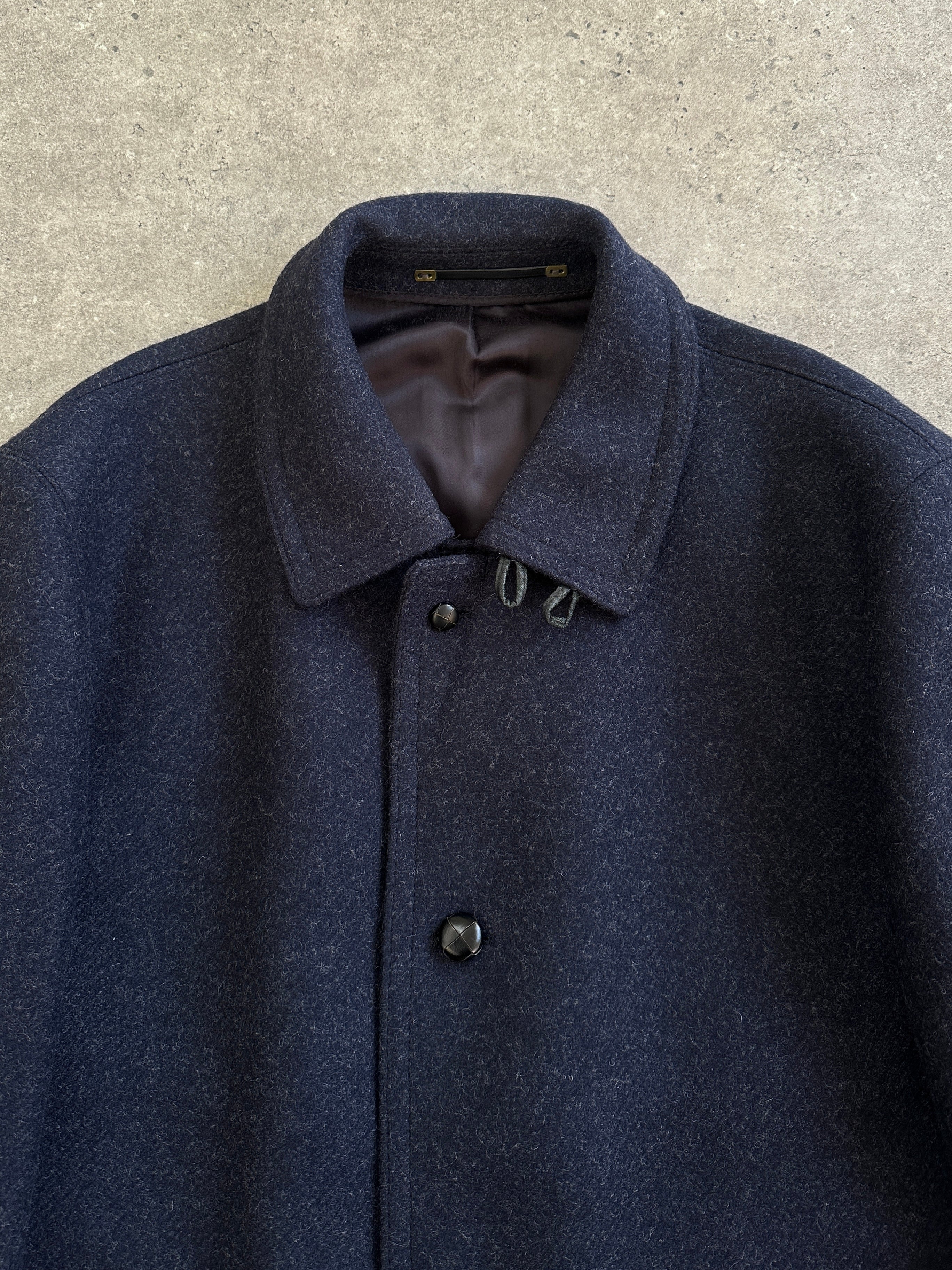 Vintage 1990s pure wool high neck single-breasted coat in XL/XXL, showcasing a classic vintage coat style and textured wool fabric.