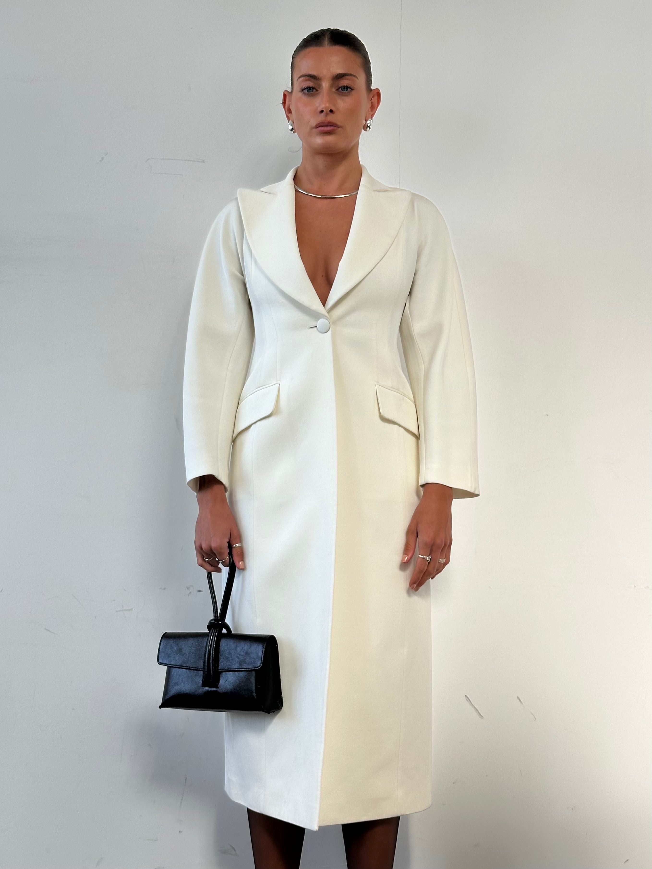 Emporio Armani wool blend fitted coat in size S, stylish outerwear with tailored fit and classic design, shown on a model.