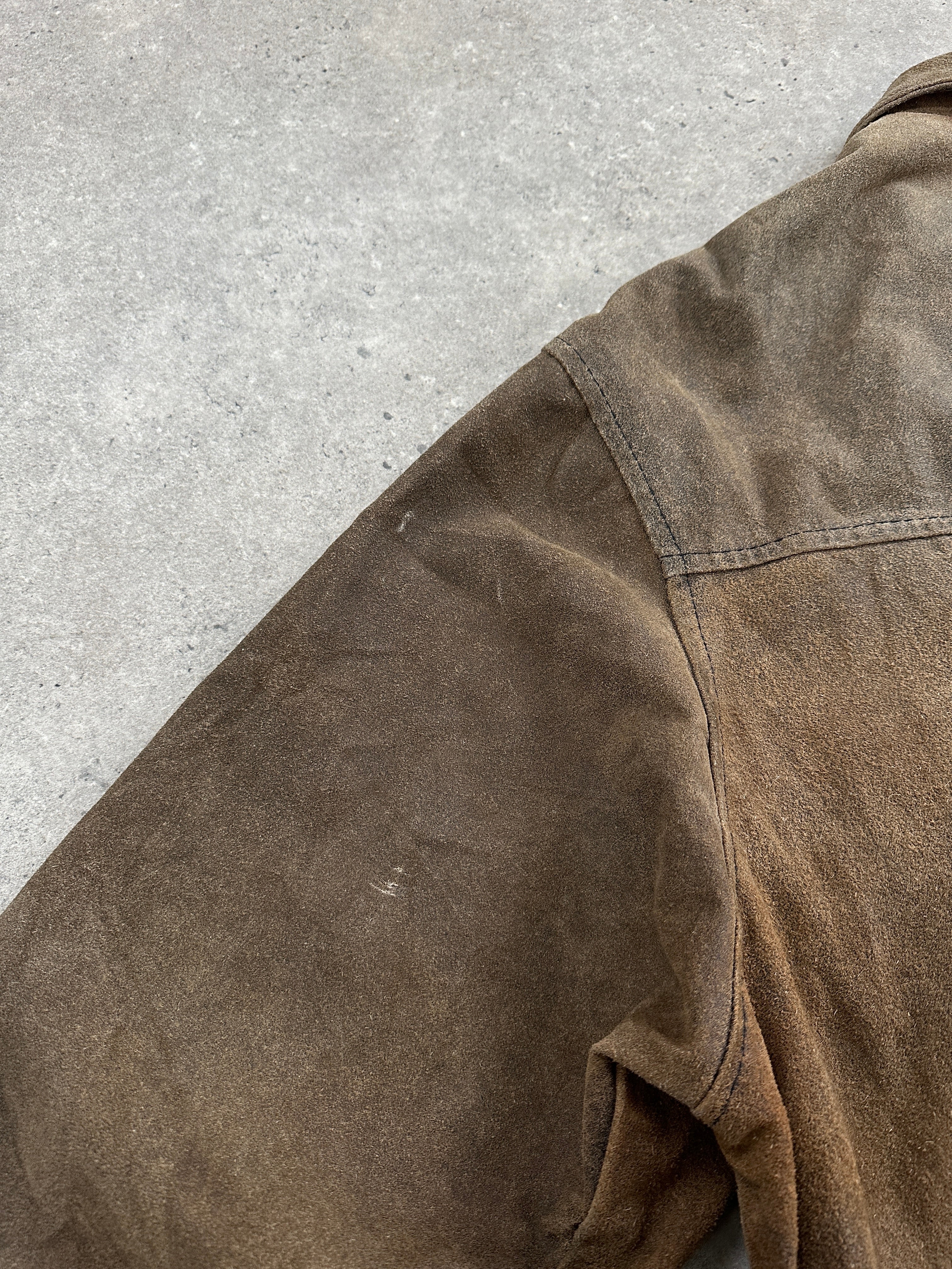 Vintage 1980s boxy leather jacket in XL size, featuring classic distressed leather and retro style.