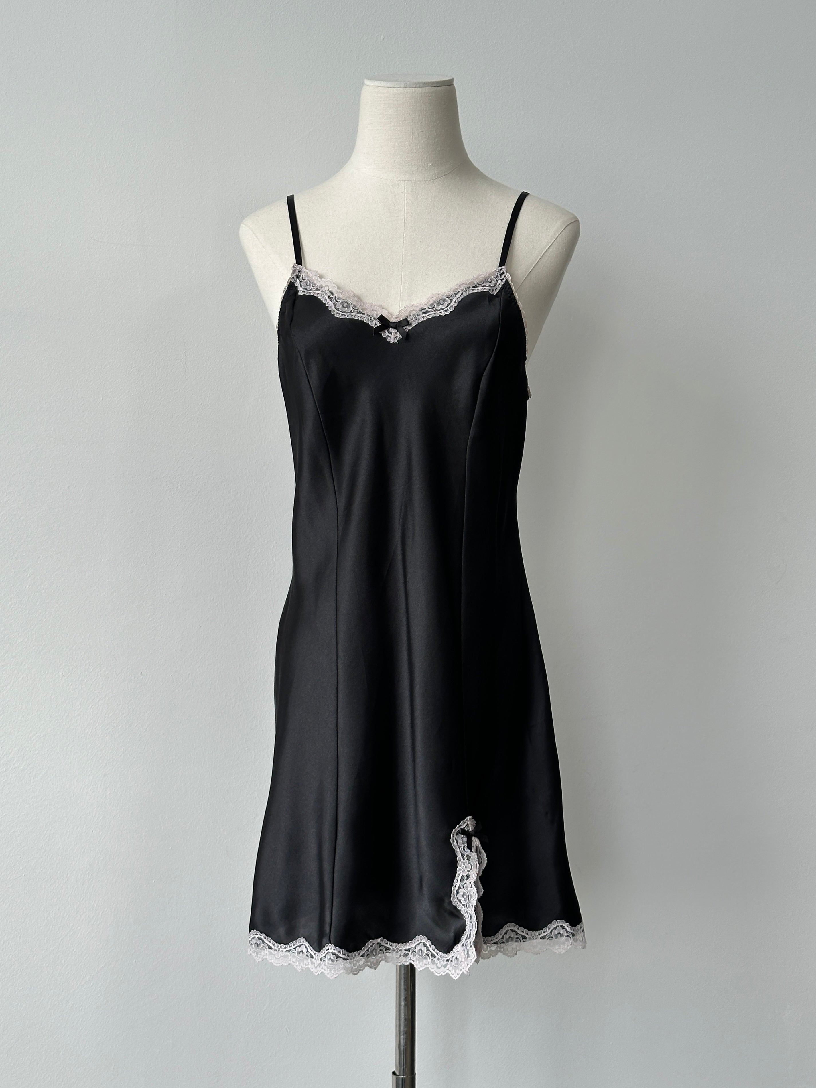 Vintage 1990s satin lace mini slip dress in black with delicate lace trim, size small to medium, vintage fashion style.