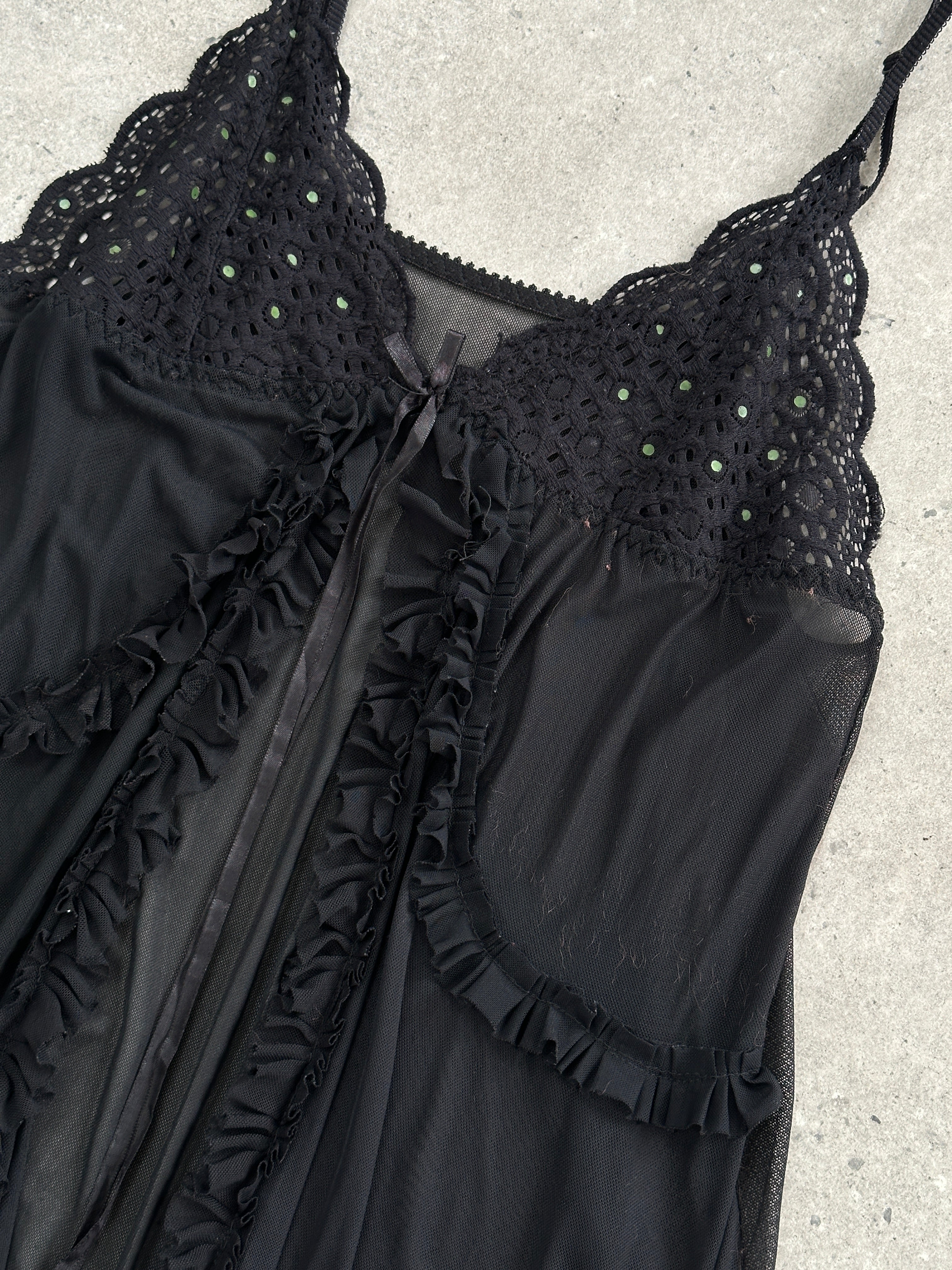 Vintage 2000s lace babydoll cami top with asymmetric split design, featuring delicate lace details and adjustable straps.