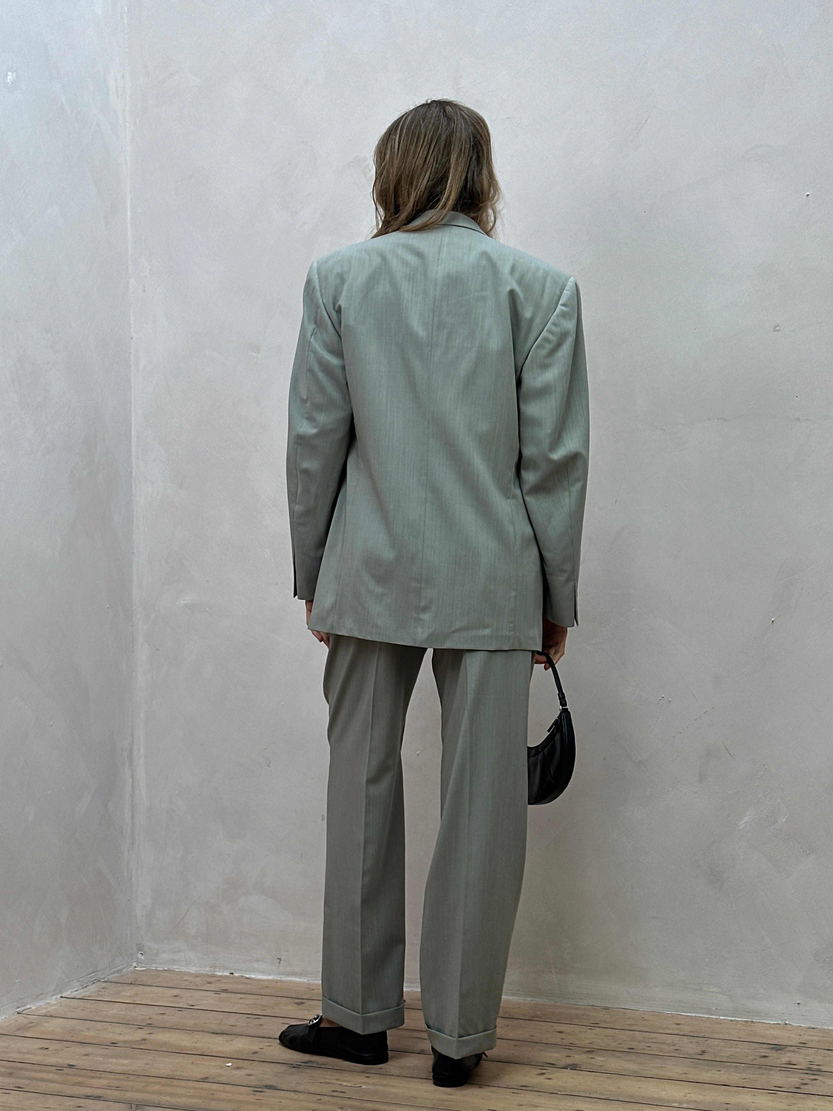 Vintage Italian vintage pure wool single-breasted jumpsuit in size 38R/W30, featuring classic tailored details and a fitted silhouette.