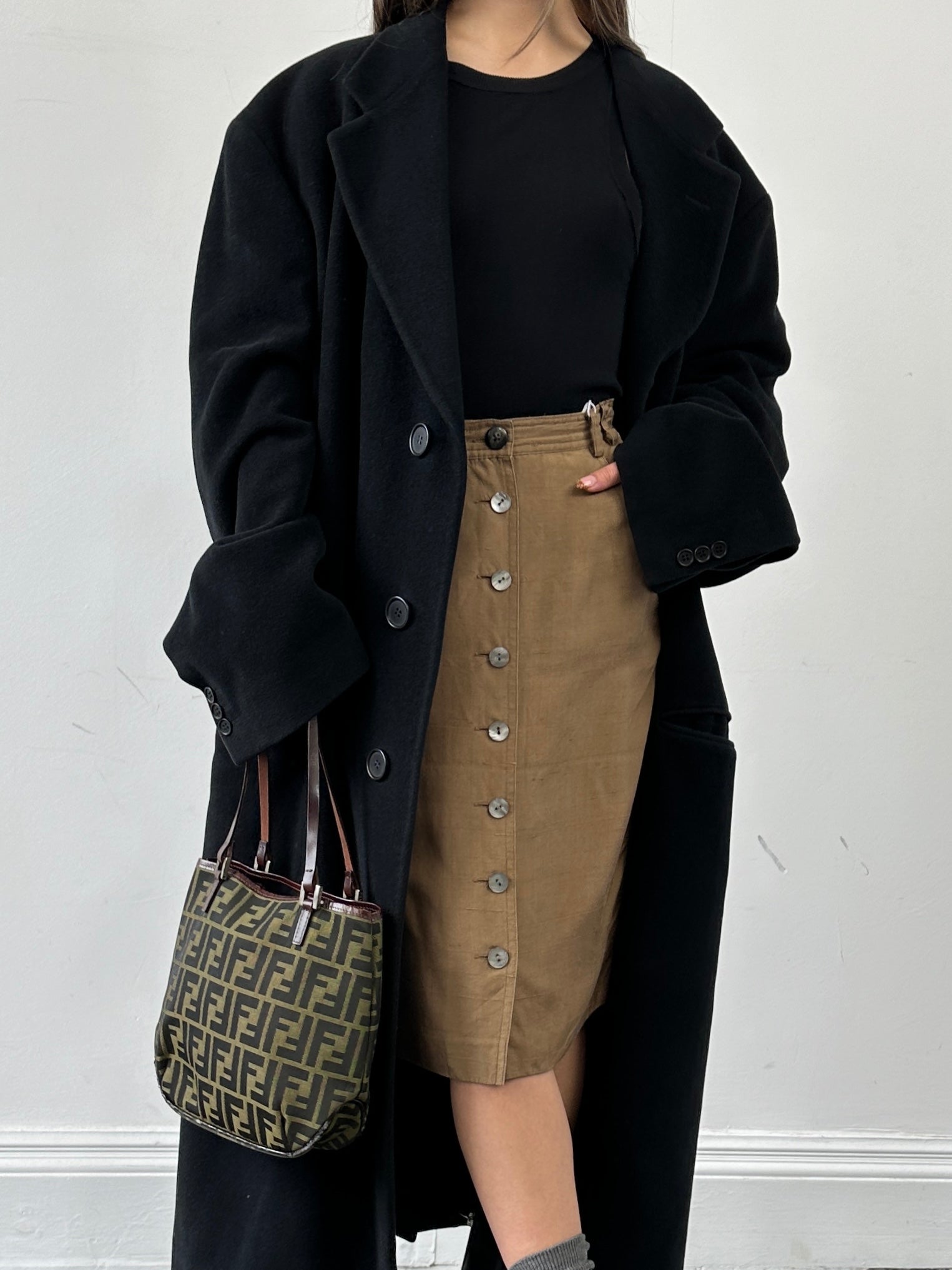 Jaeger pure silk button-down midi skirt in W24, featuring a smooth silk fabric, button details, and a classic midi length.