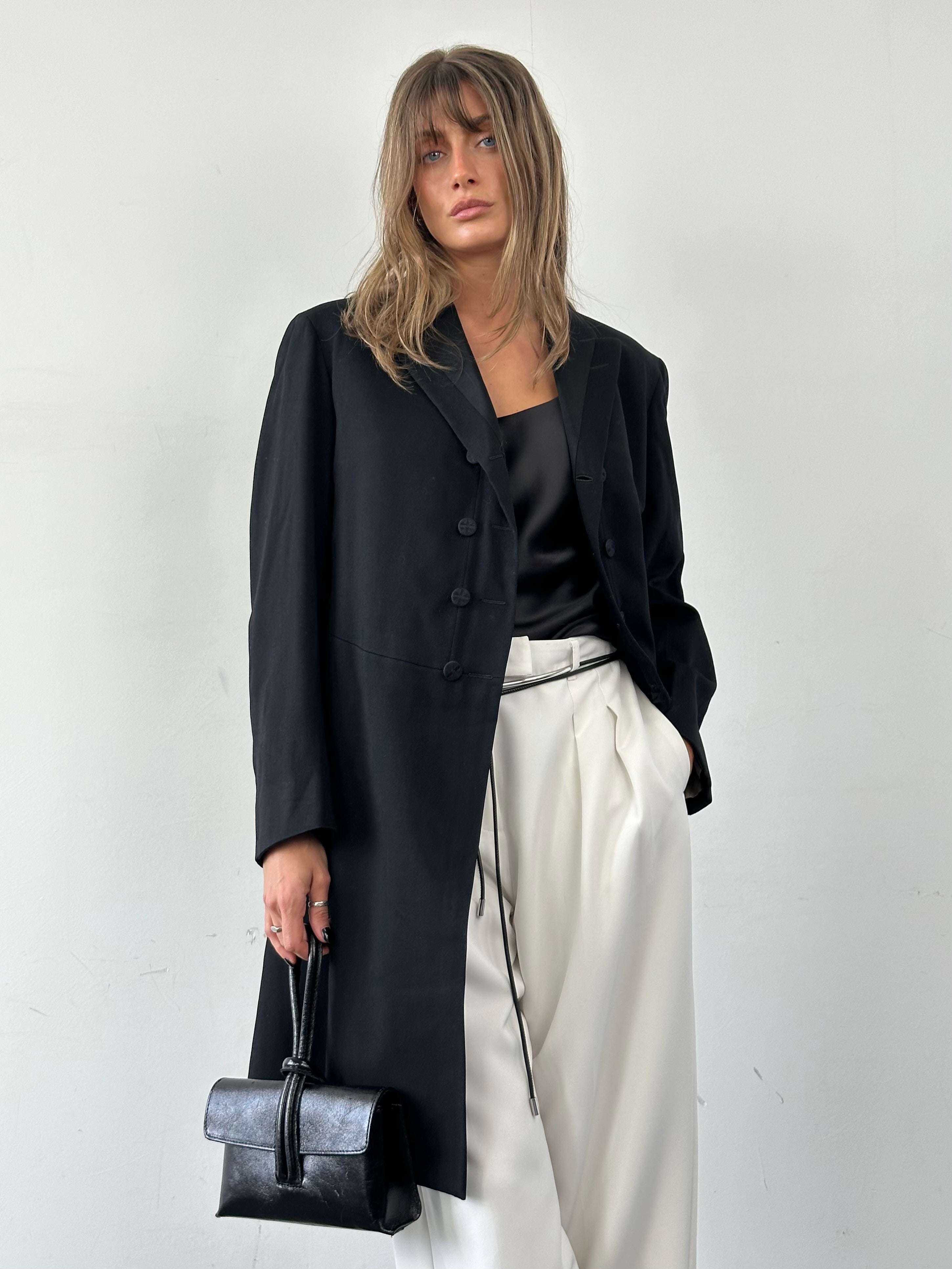Vintage men's tuxedo coat in size M/L, classic black formal coat with satin lapels and tailored fit.
