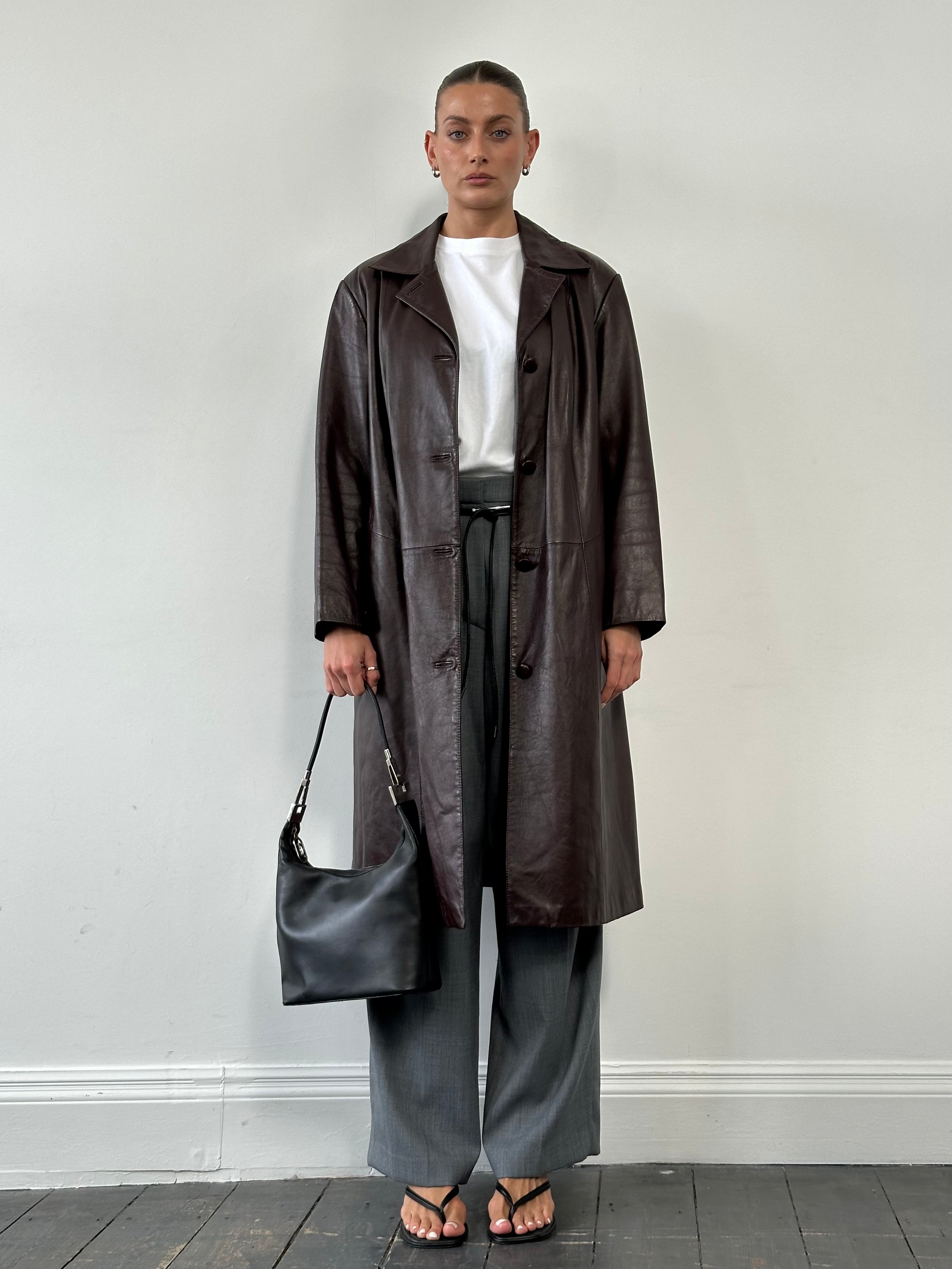 Vintage leather trench coat jacket, size large, with classic design and weather-resistant leather in natural vintage finish.