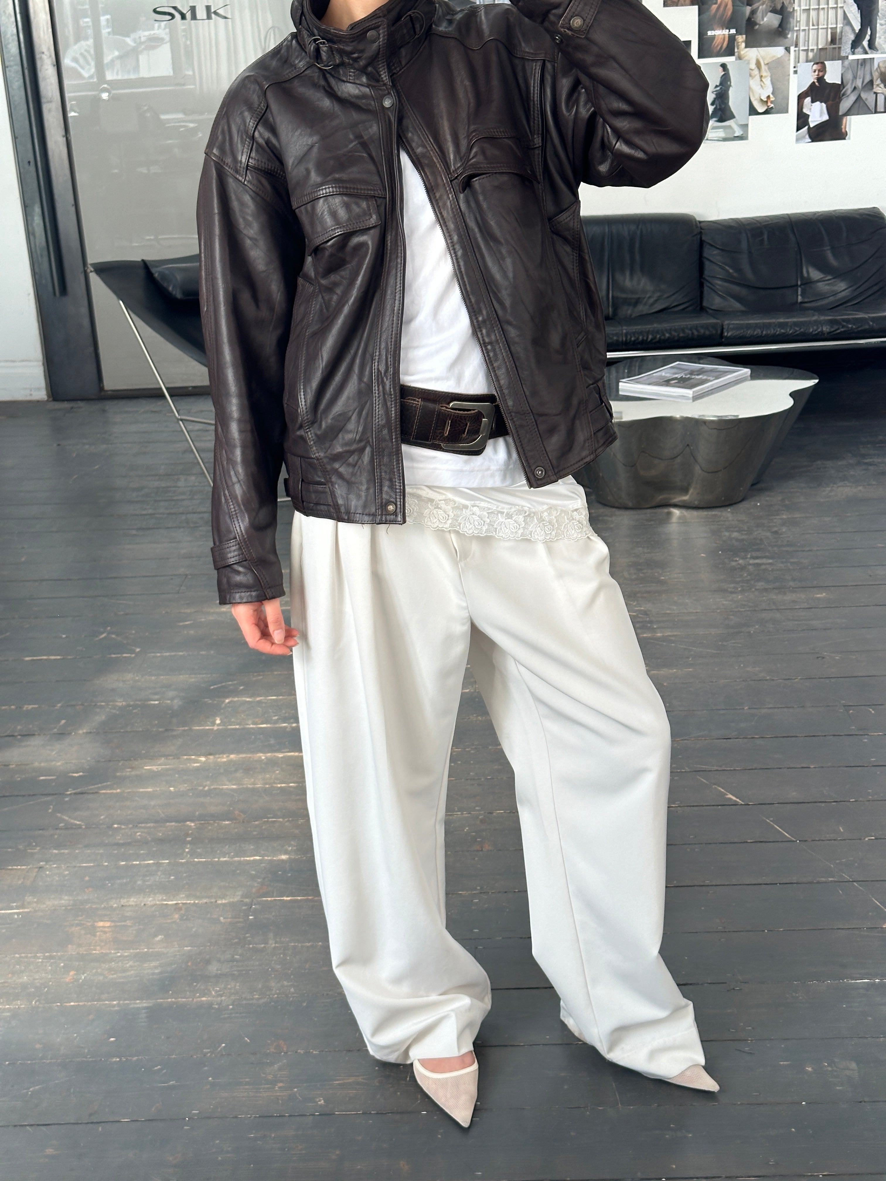 Vintage French 1980s high neck leather bomber jacket, front view showcasing classic design and rich leather texture.