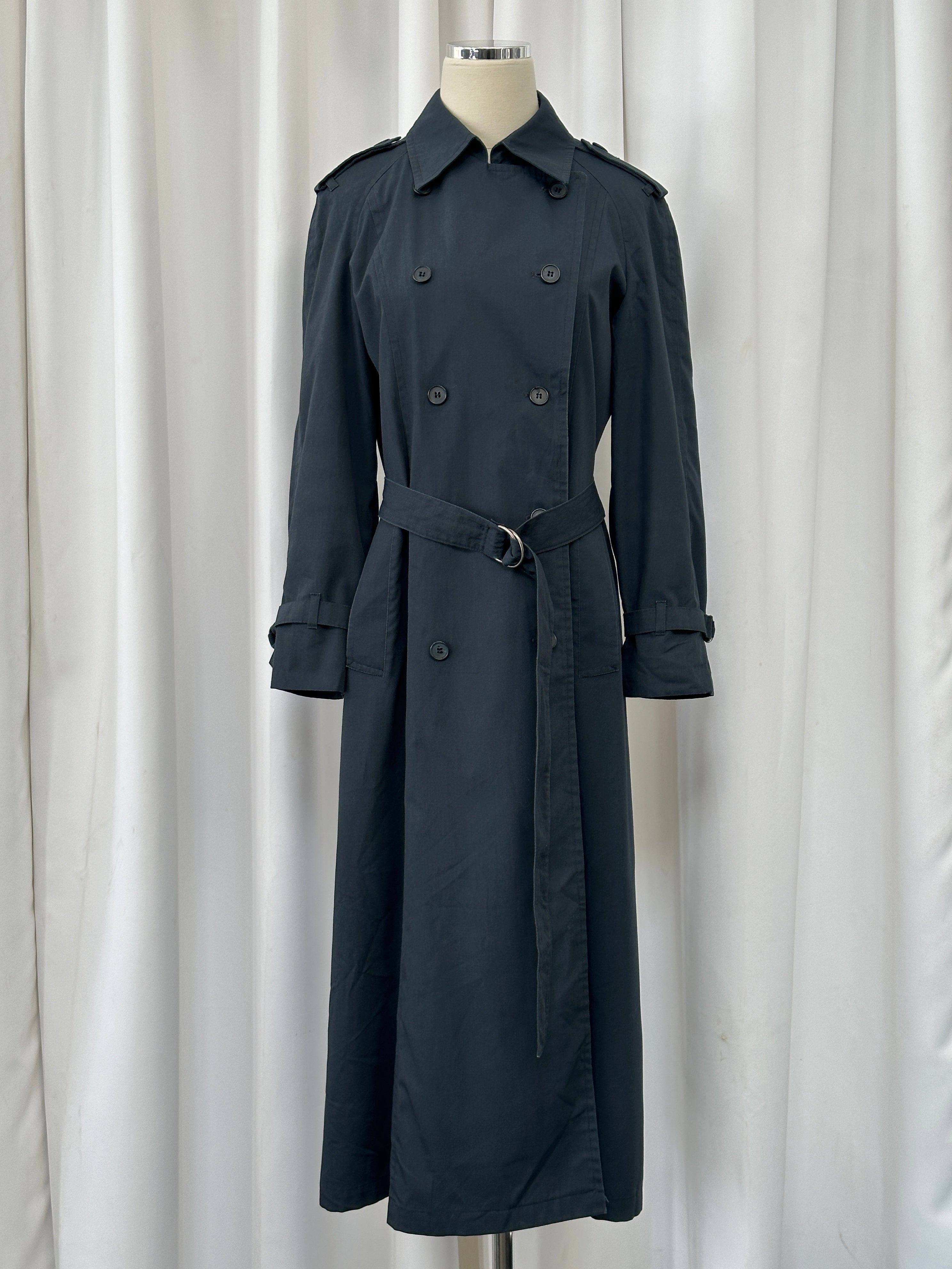 London Fog 1980s double-breasted cotton trench coat in size S, classic beige color, shown on a hanger.