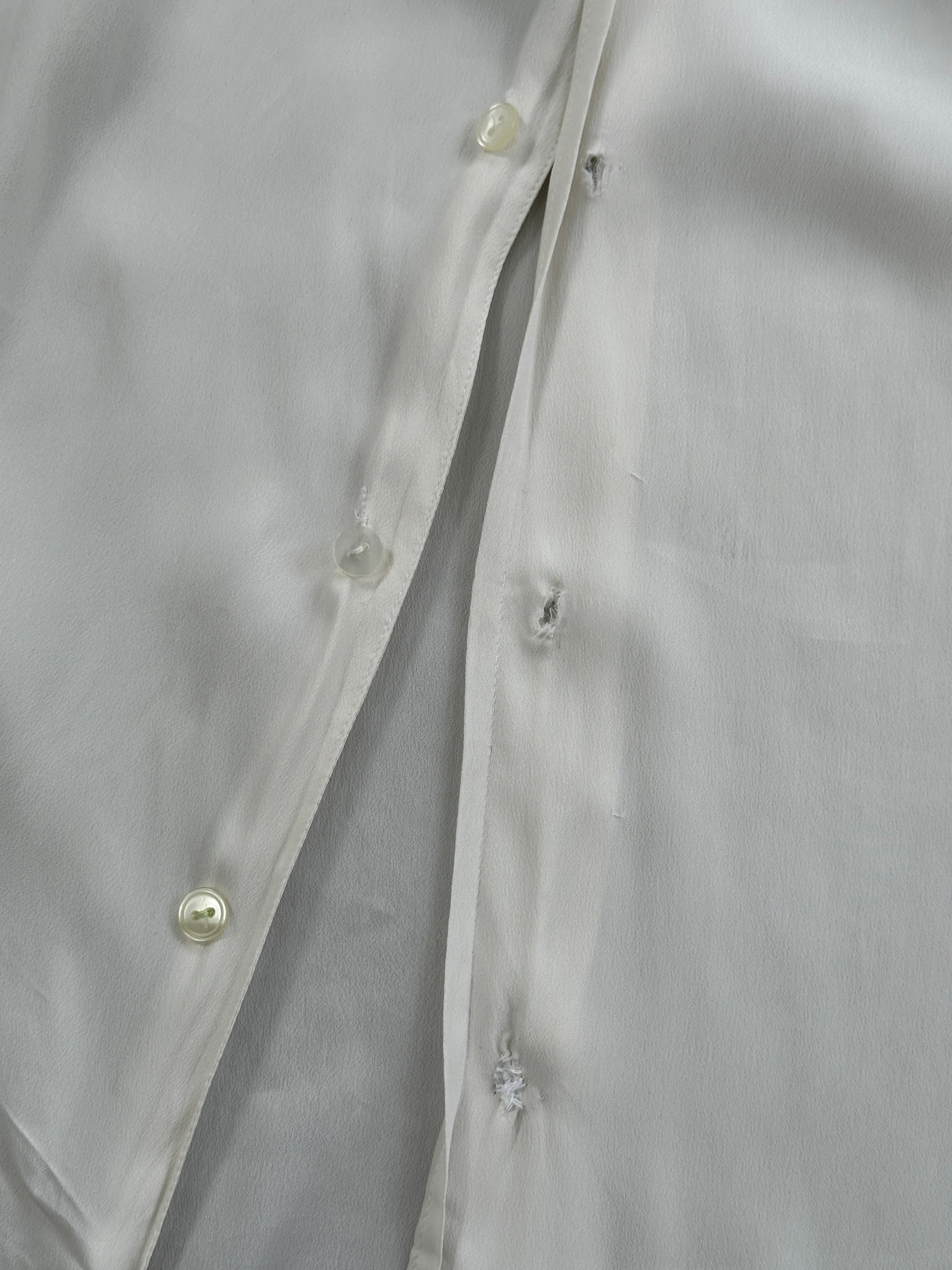 Vintage silk flowy shirt in size L, featuring a relaxed fit and elegant drape, ideal for casual or dressy occasions.