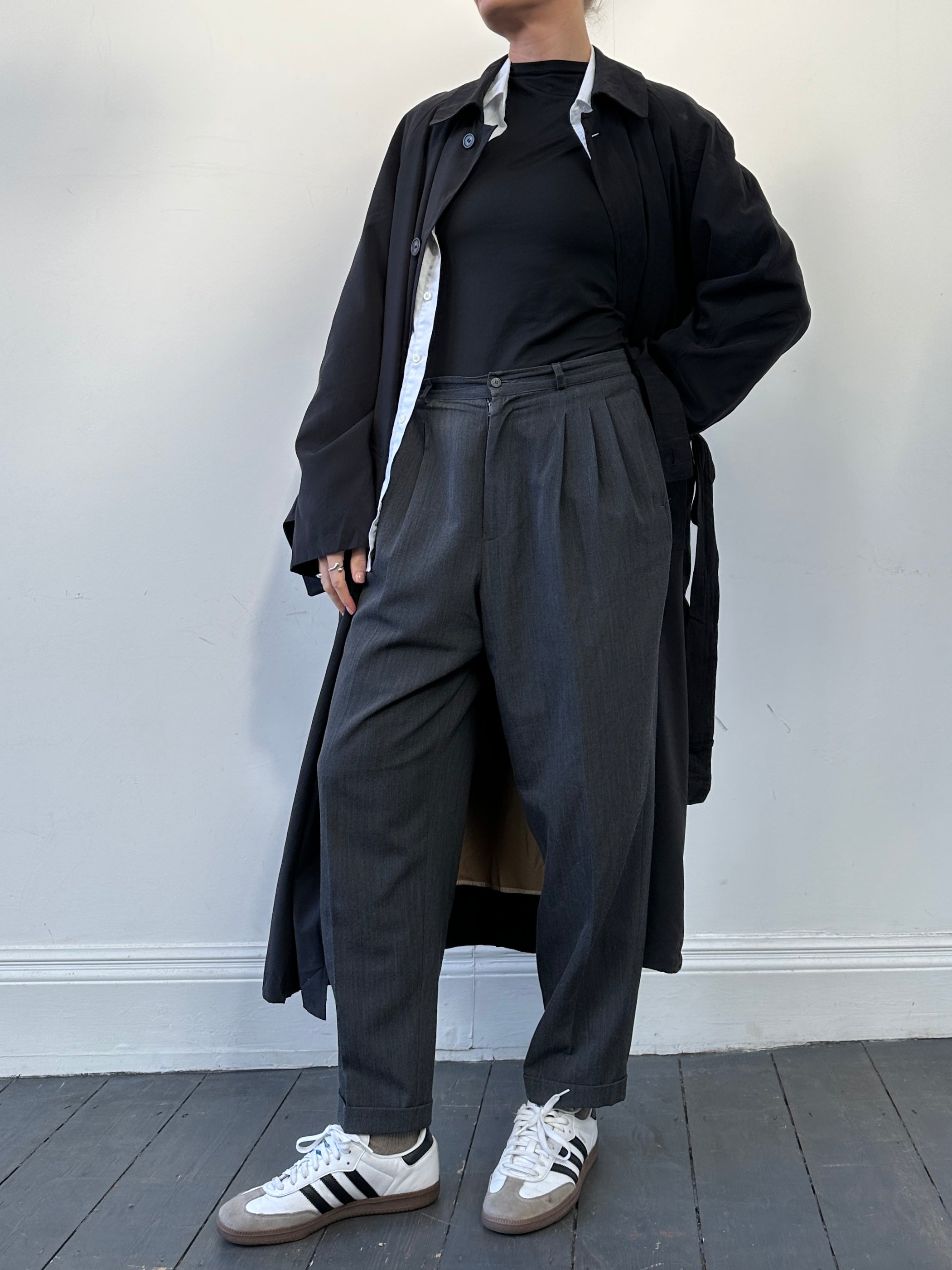 Lacoste wool pleated balloon leg trousers in size W30, featuring logo detail and tailored fit with pleats and a relaxed silhouette.