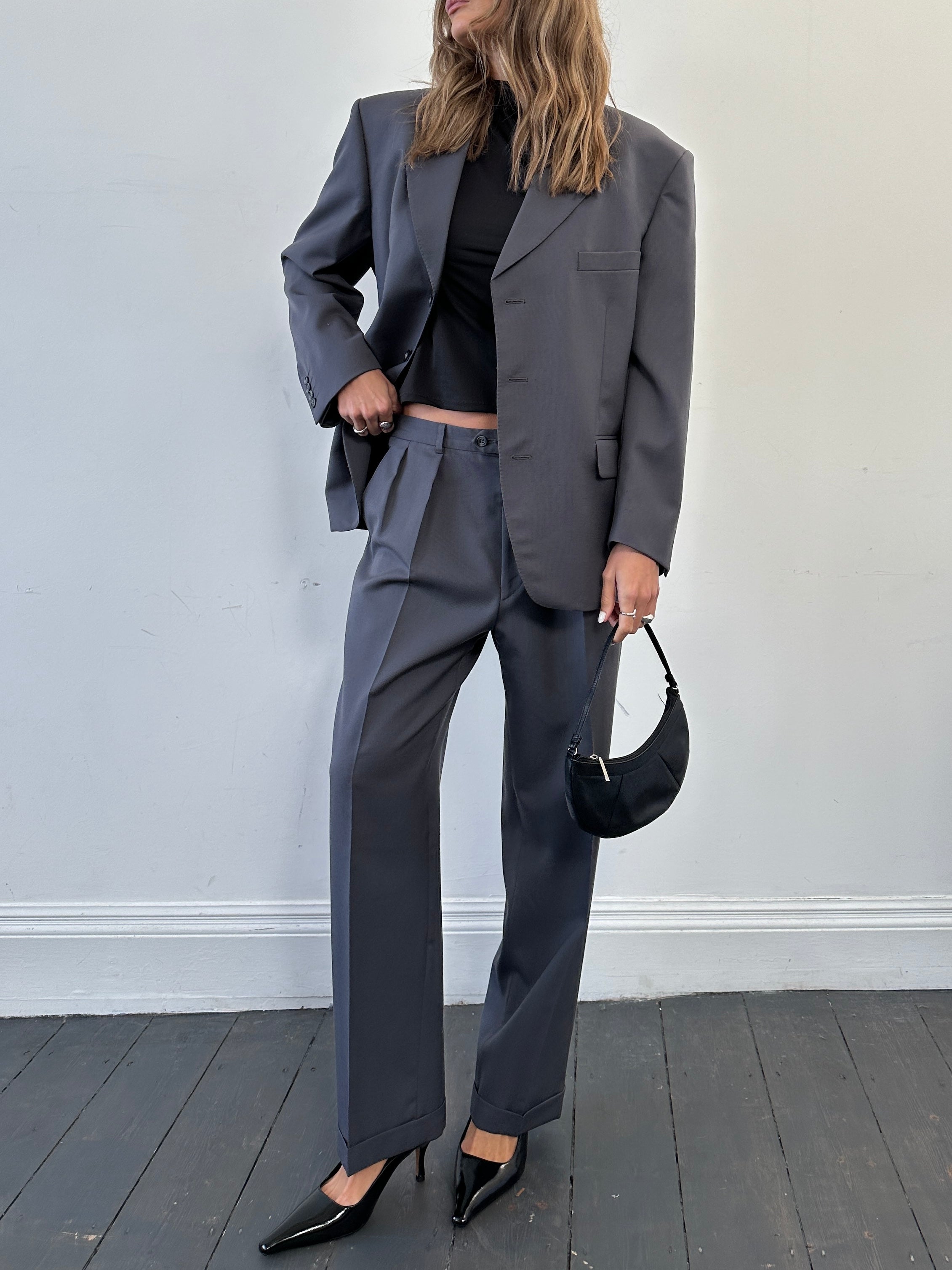 Christian Dior wool single-breasted jumpsuit in size 42S/W34, tailored fit with lapel collar and stylish design.