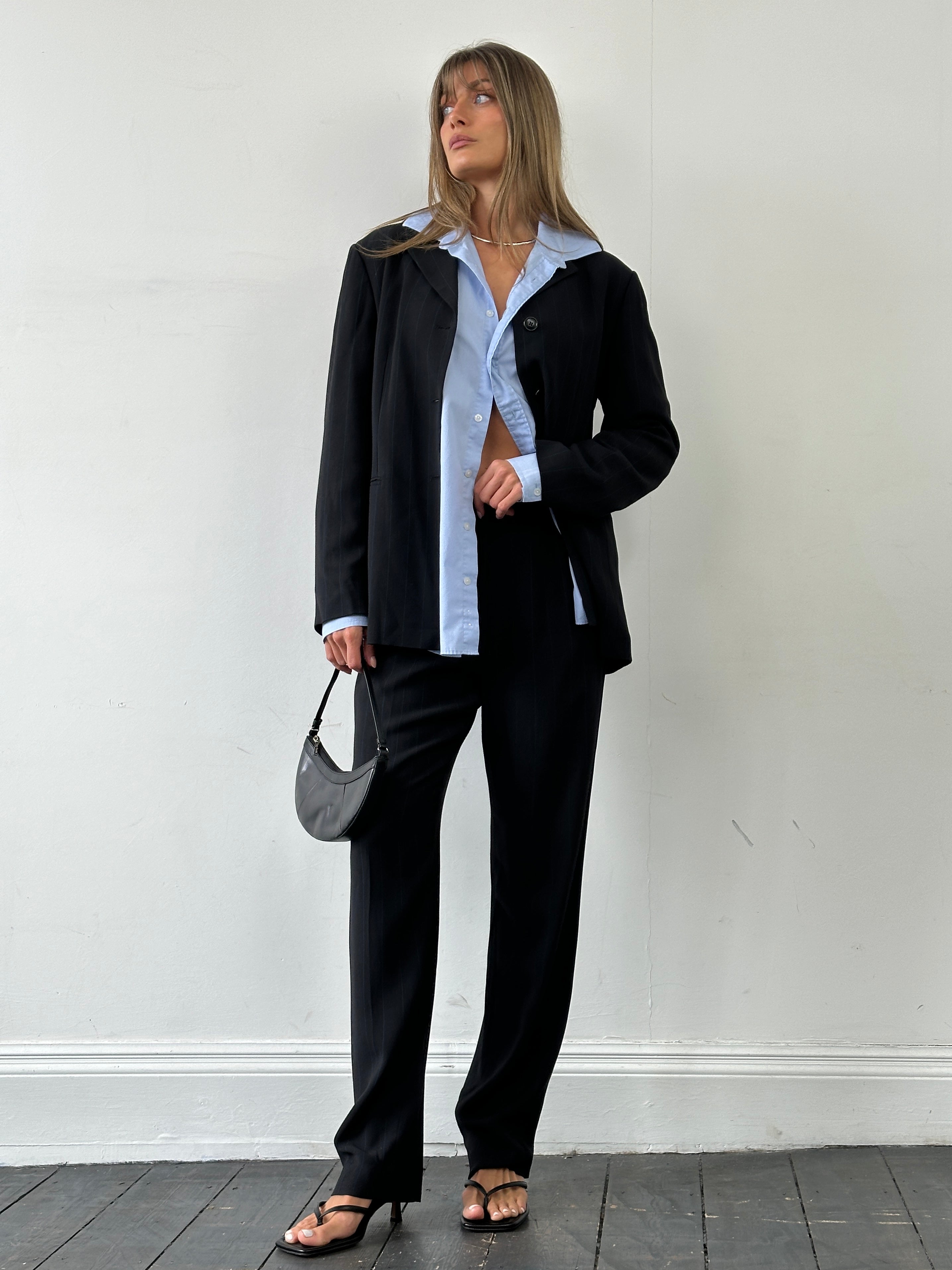 Marella virgin wool blend jumpsuit with stipe pattern, single-breasted design, tailored fit, and wide-leg style.