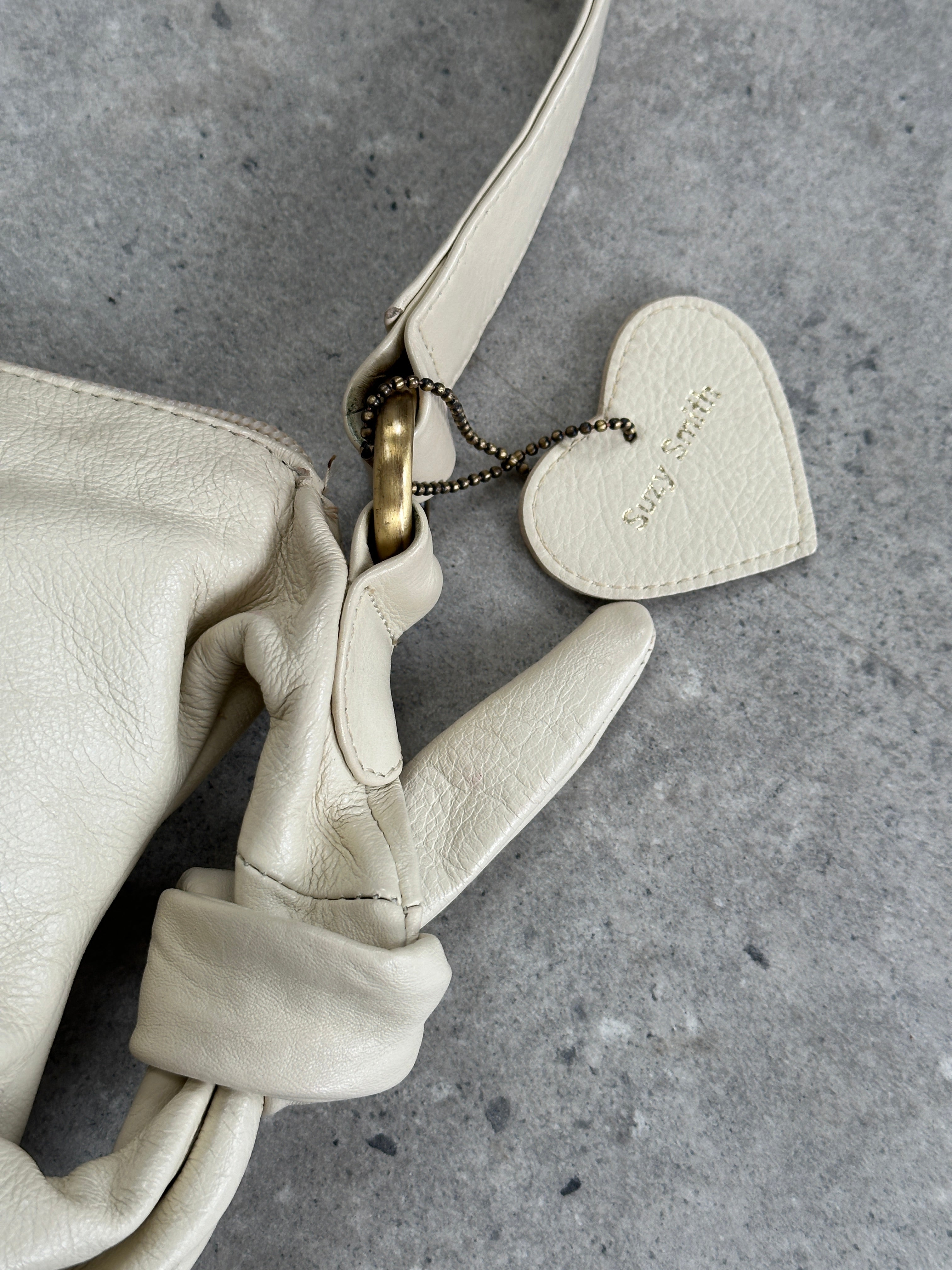 Vintage soft leather knot shoulder bag with elegant design and sturdy strap, perfect for stylish everyday use.