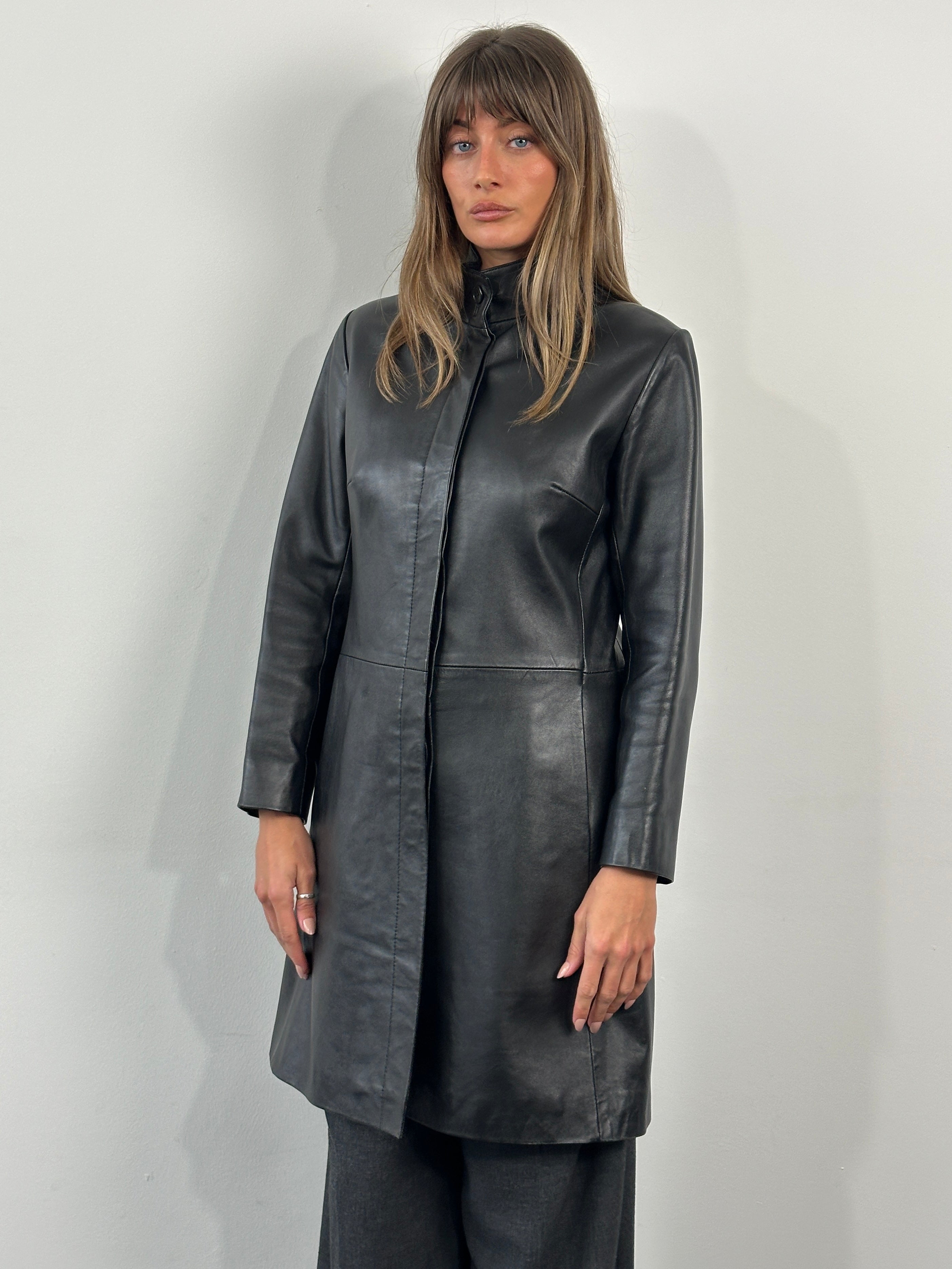 Vintage 1990s high-neck leather trench coat, minimalist design, short style, vintage brand, black leather, front view.