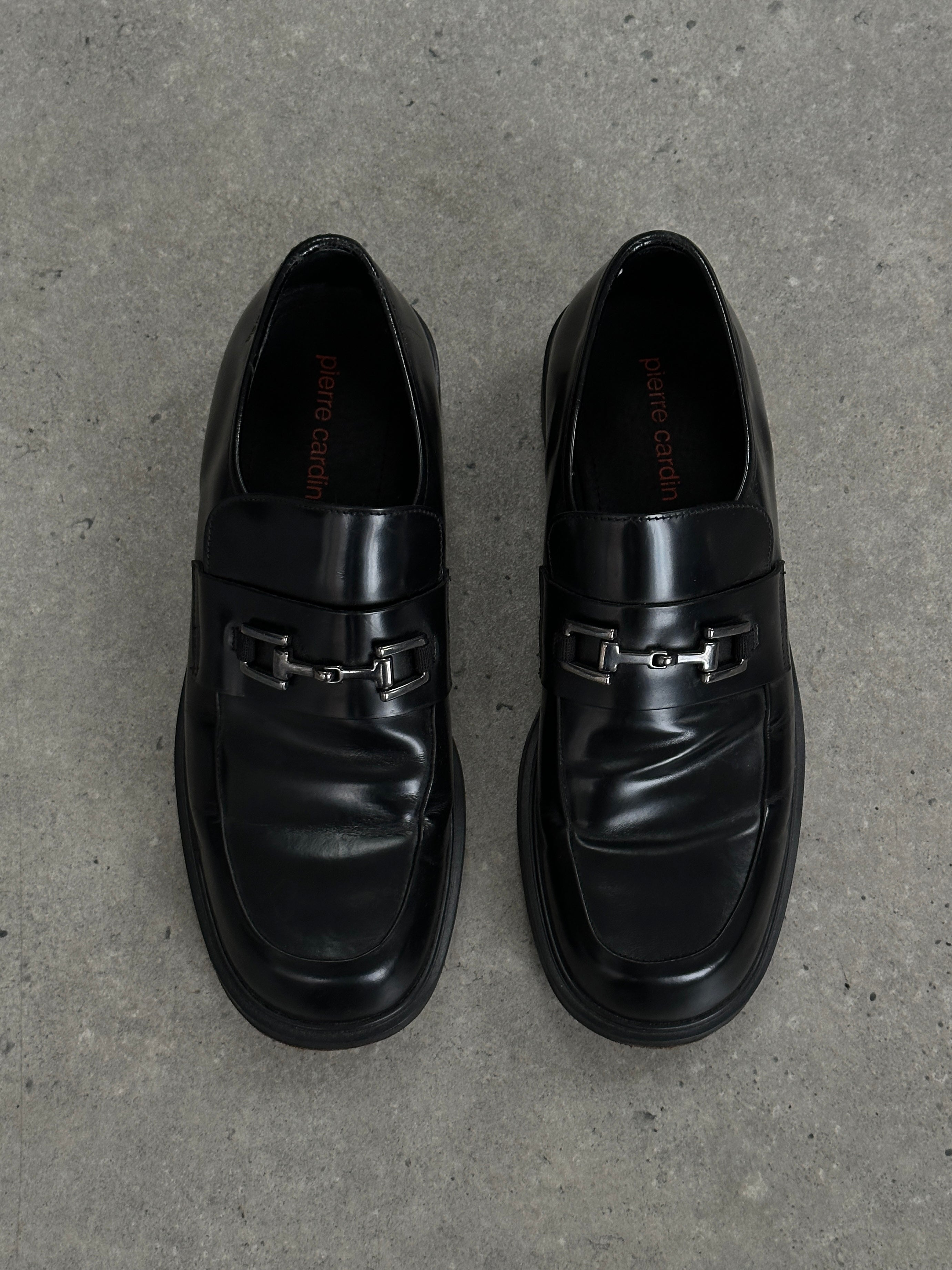 Pierre Cardin leather horsebit loafers in UK size 9, featuring classic design and polished finish, displayed on a neutral background.