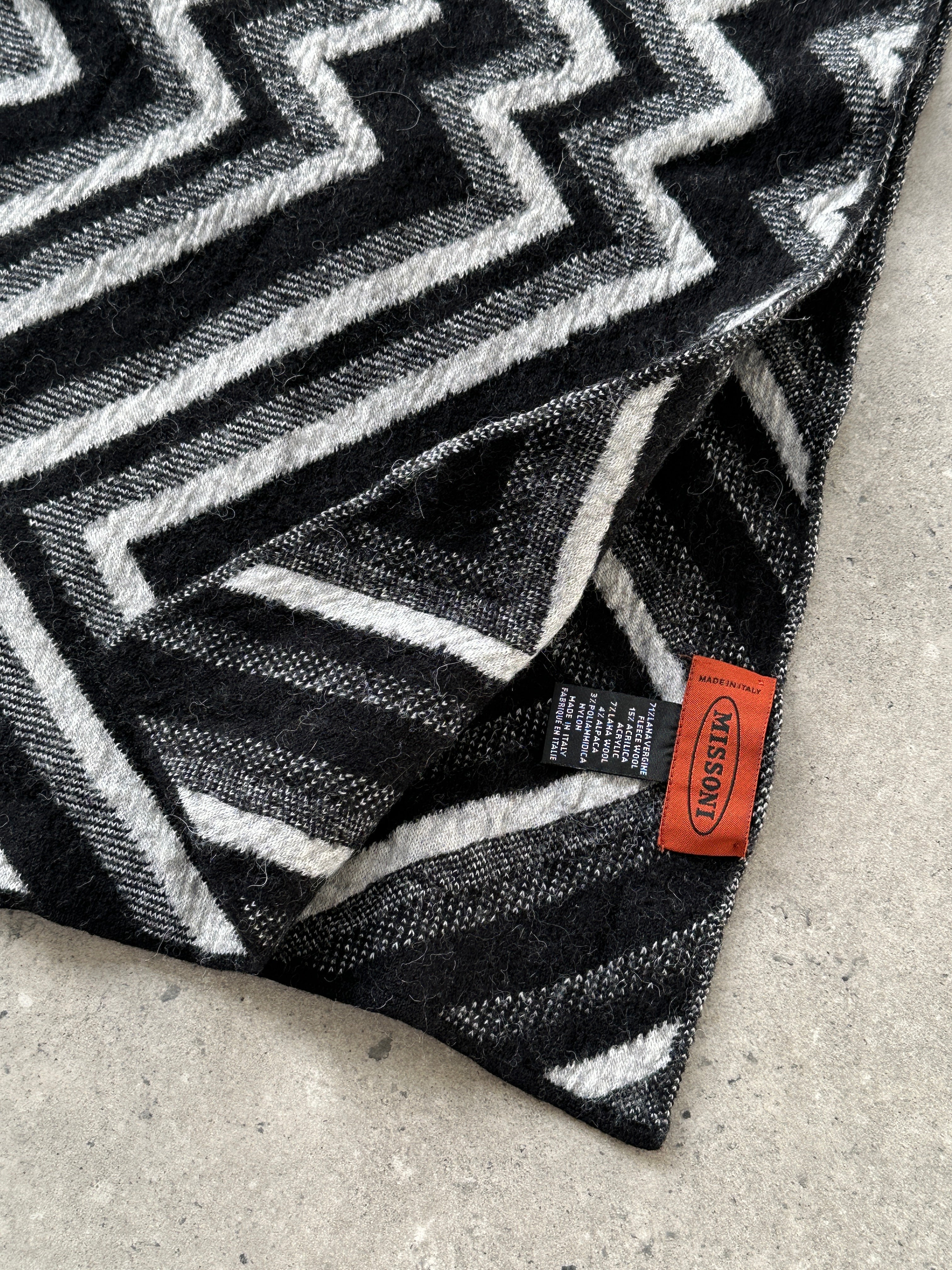 Missoni wool chevron scarf with colorful patterned design, showcasing vibrant zigzag stripes in soft, luxurious fabric.