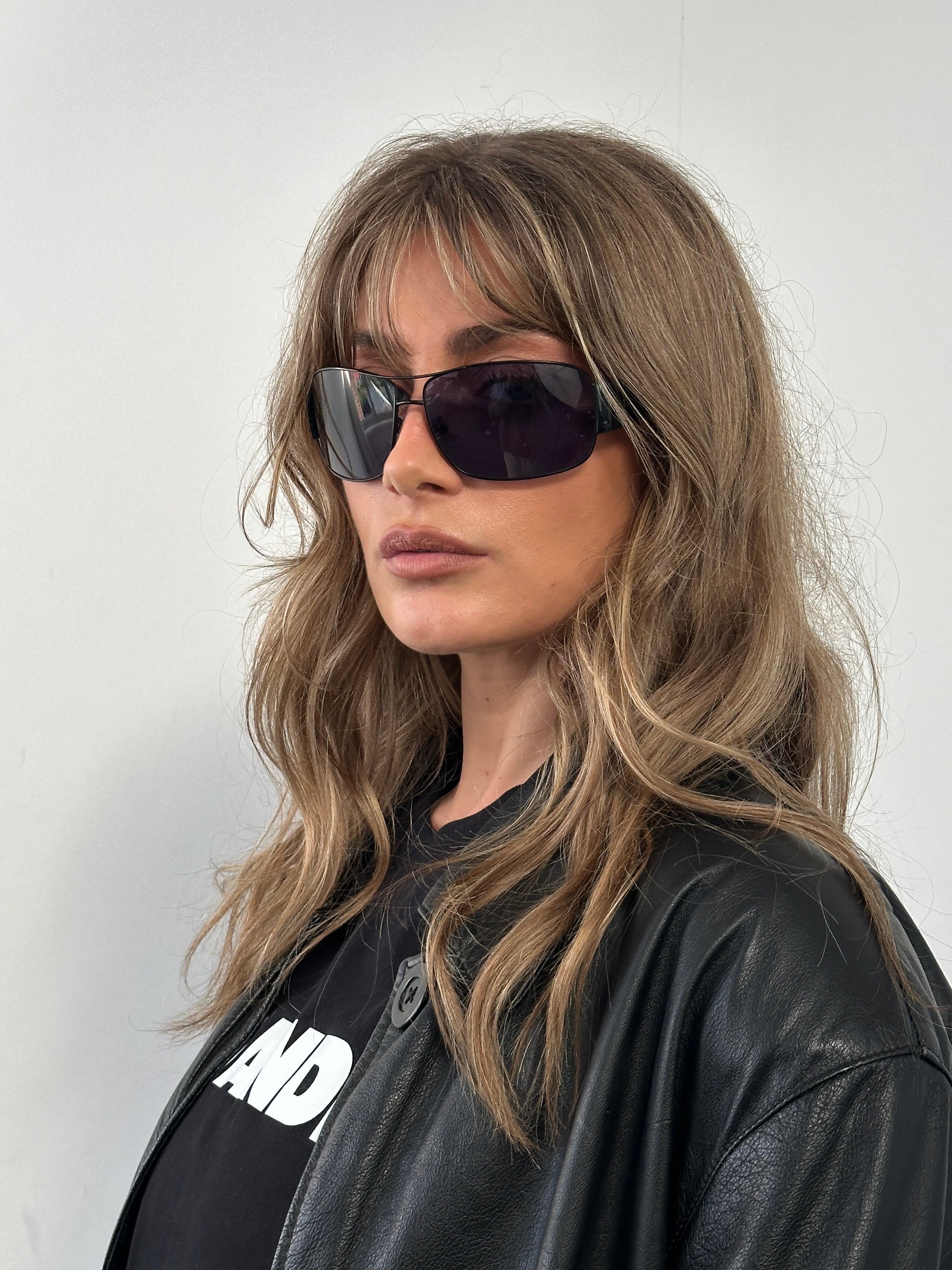 Prada aviator shield sunglasses with dark tinted lenses and metal frame, stylish eyewear for sun protection and fashion.