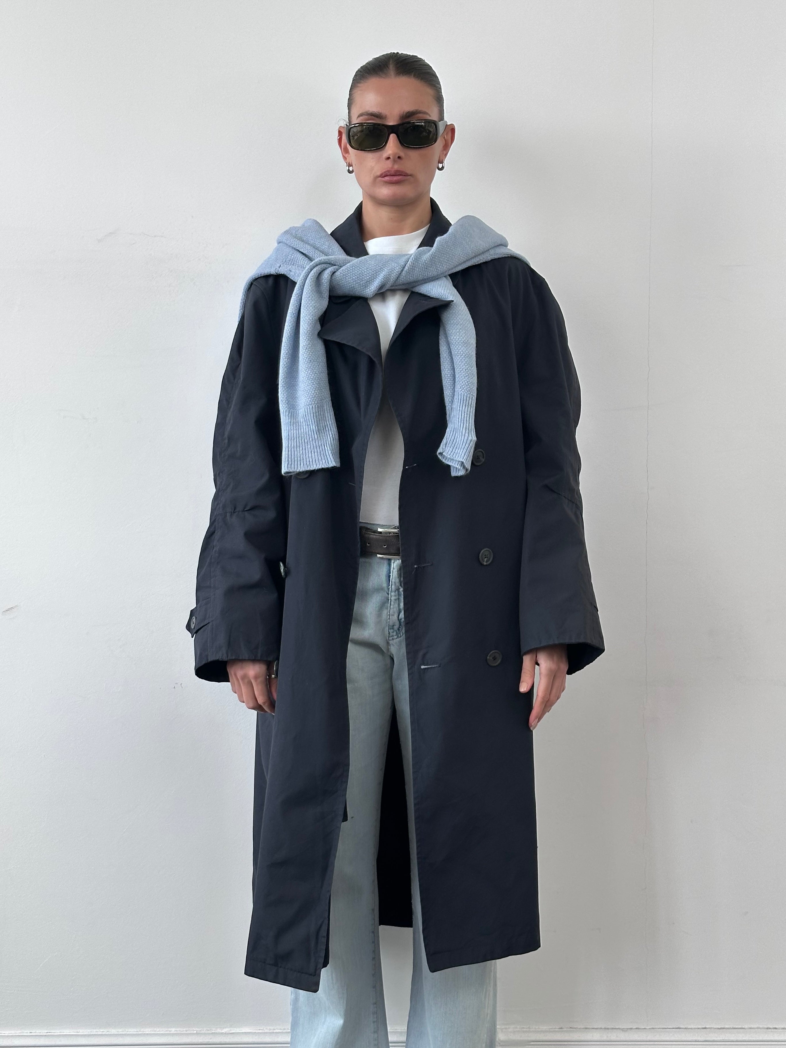 Christian Dior Monsieur double-breasted trench coat in XL, showing beige fabric, classic collar, and button details.