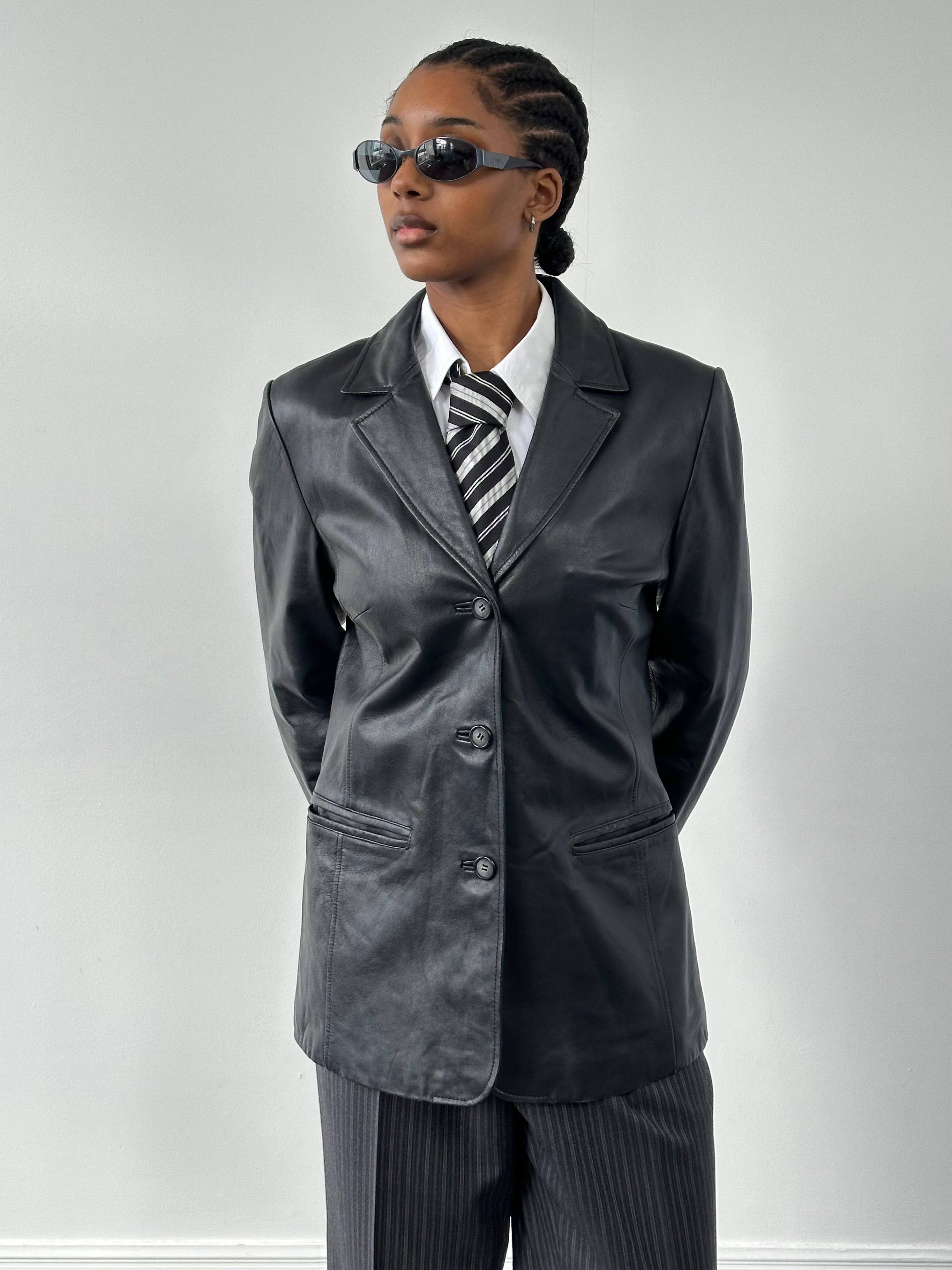 Vintage 1990s minimal leather jacket in size M, stylish black leather outerwear with clean lines and classic design.
