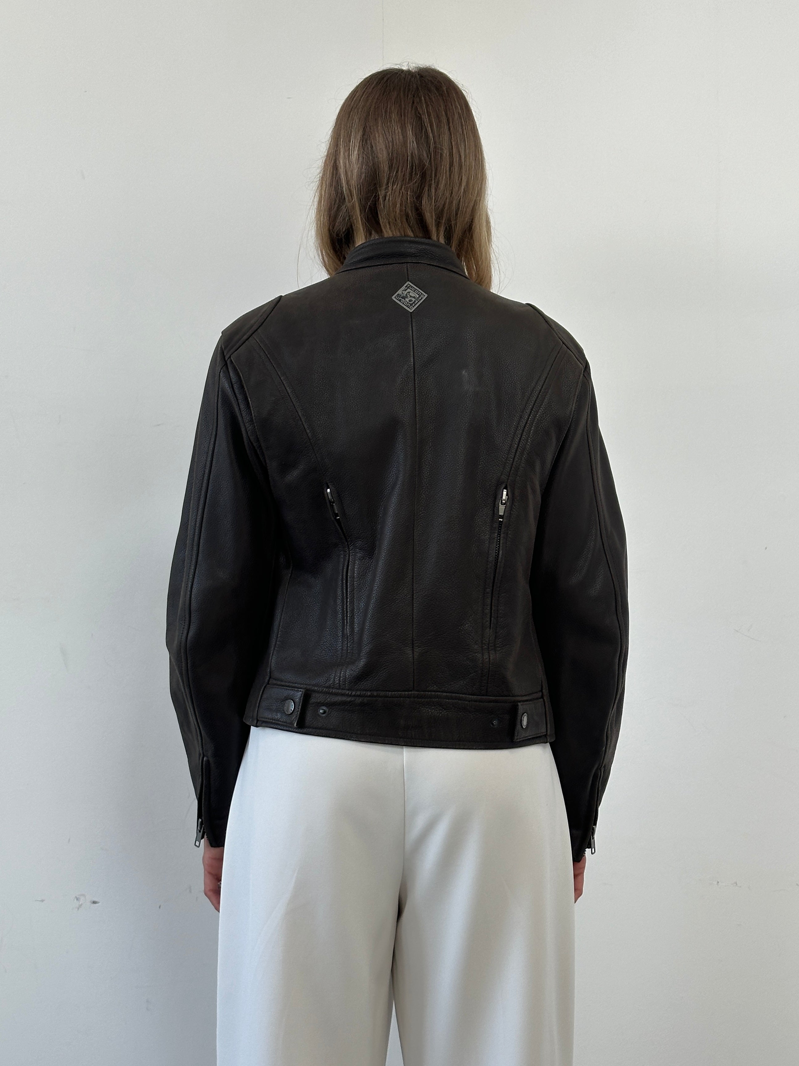 Vintage leather moto jacket in black, featuring classic design with silver hardware, size small/medium.