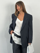 Christian Dior Monsieur 1980s pure wool stripe blazer in size 44R/XL, tailored fit with classic pattern and structured shoulders.