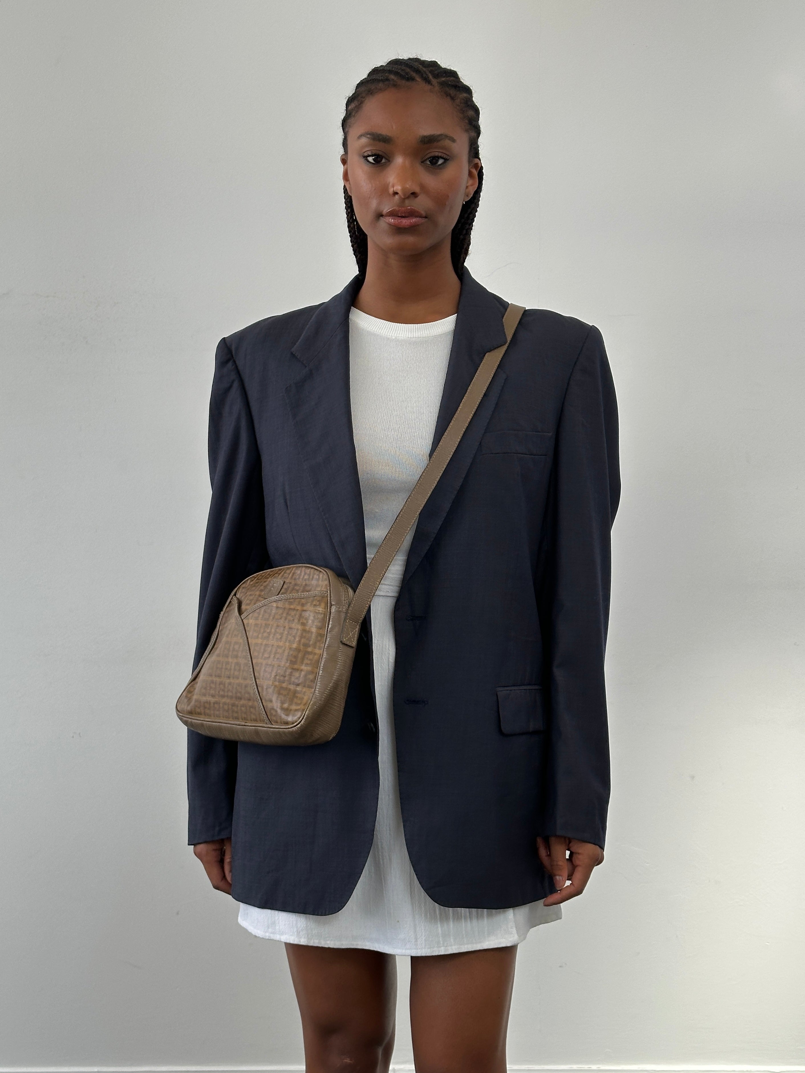 Yves Saint Laurent Pour Homme 1980s pure wool blazer in size 40R/M, tailored fit with classic lapels and button closure.