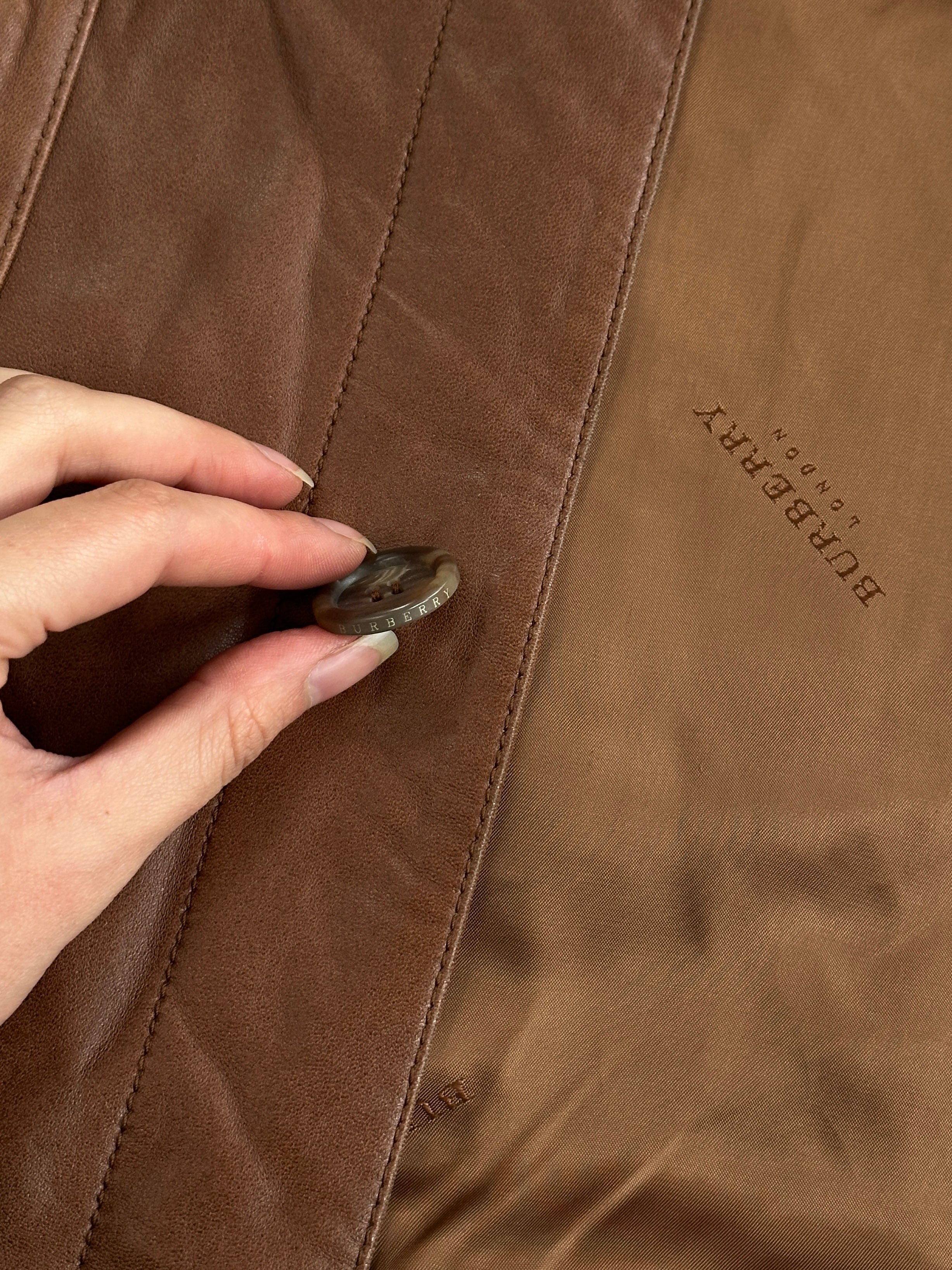 Burberry London 2000s aged smooth leather jacket in XL size, featuring classic design and detailed stitching.