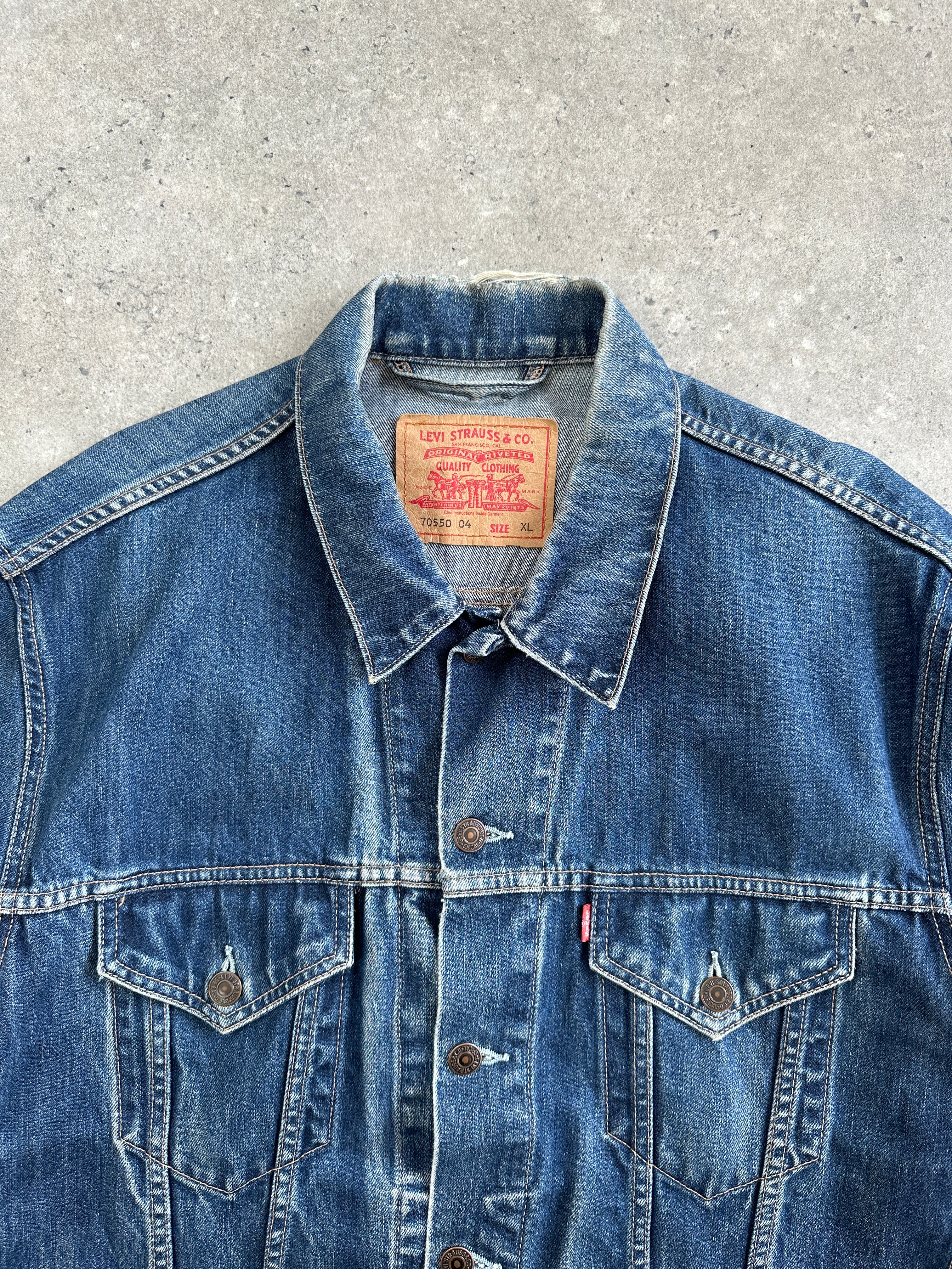 Levi’s 1990s mid wash denim jacket in XL size, showing classic front with button closure and chest pockets.