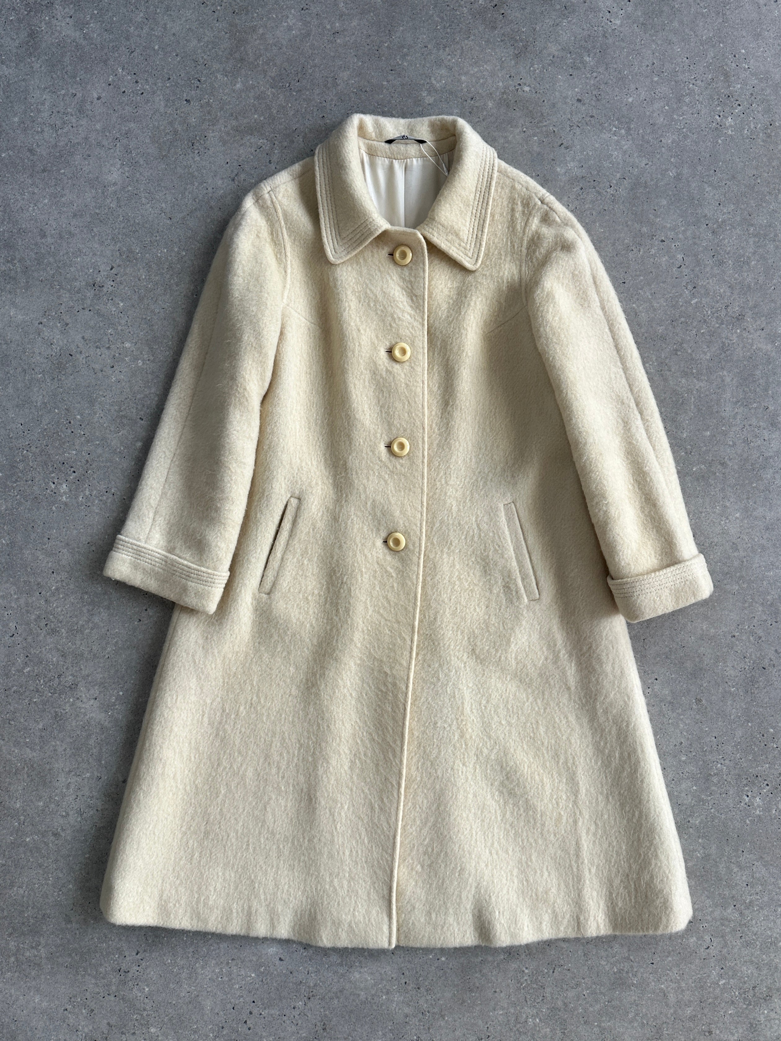 Vintage fuzzy wool mohair single-breasted coat in size L, shown hanging with textured fabric and classic lapel details.