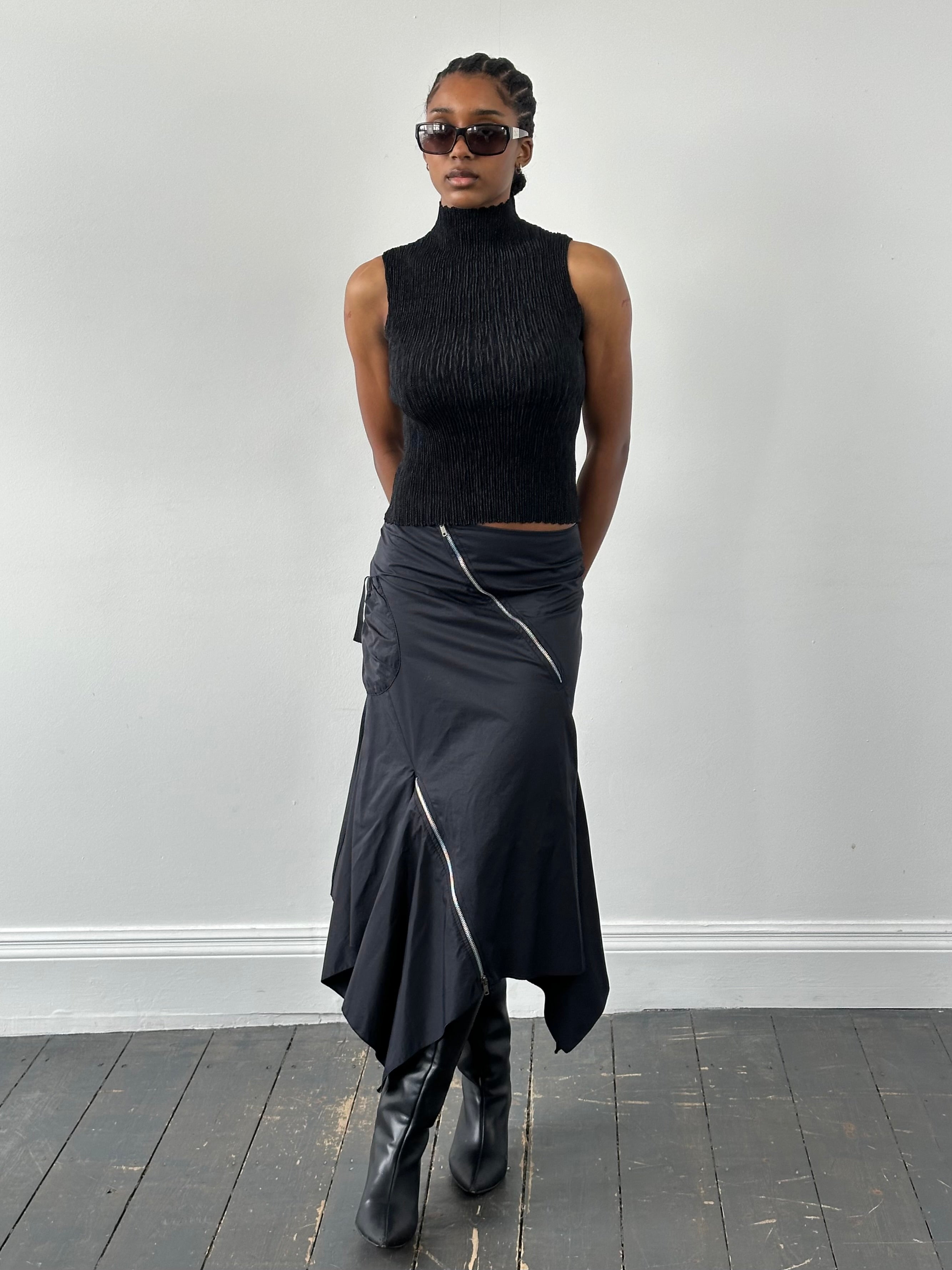 Vintage 1990s cotton multi-zip ruffle skirt in size W28, featuring layered ruffles and a retro style.
