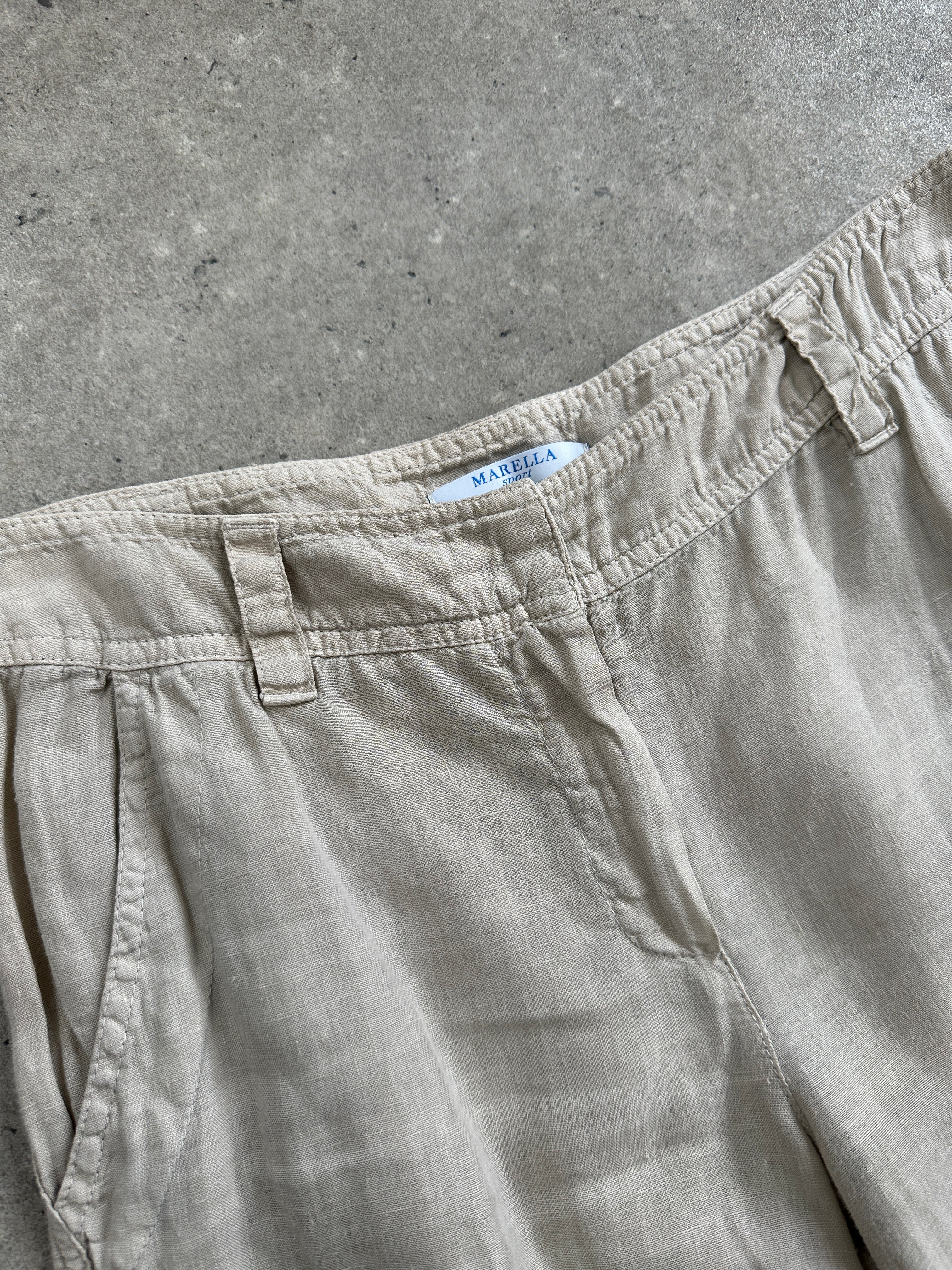 Marella 2000s low-waisted straight-leg trousers in W28, showing the fit and fabric details.