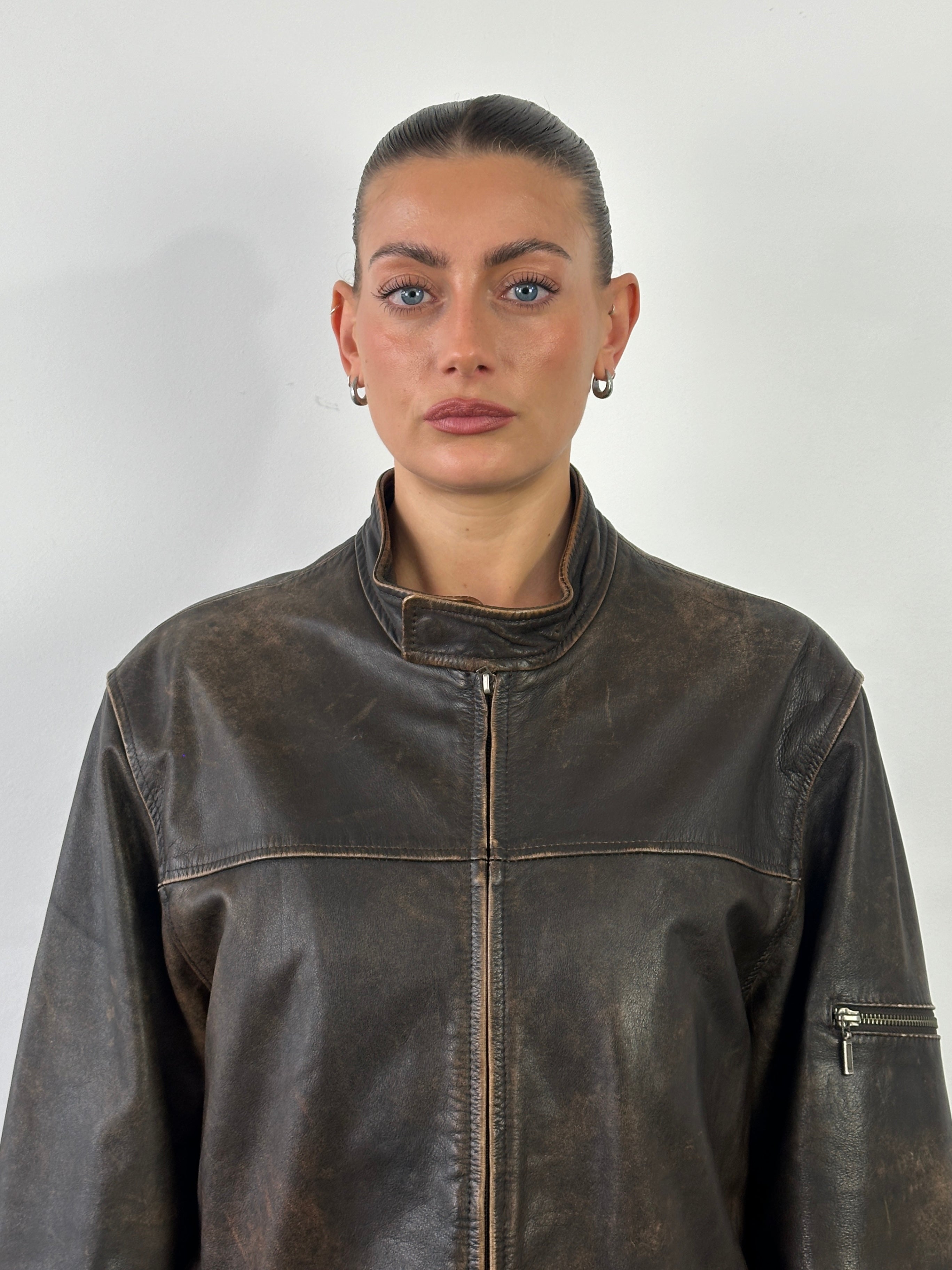 Vintage Moto aged leather jacket in size L, featuring distressed brown leather and classic motorcycle style.