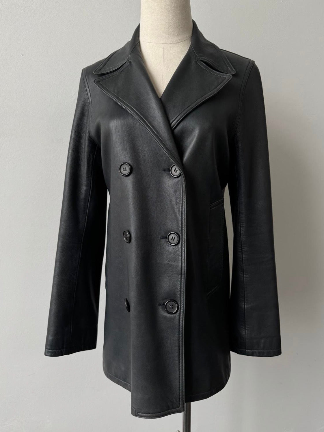 Jaeger 2000s double-breasted leather jacket in black, featuring front buttons and classic tailored design, size S/M.