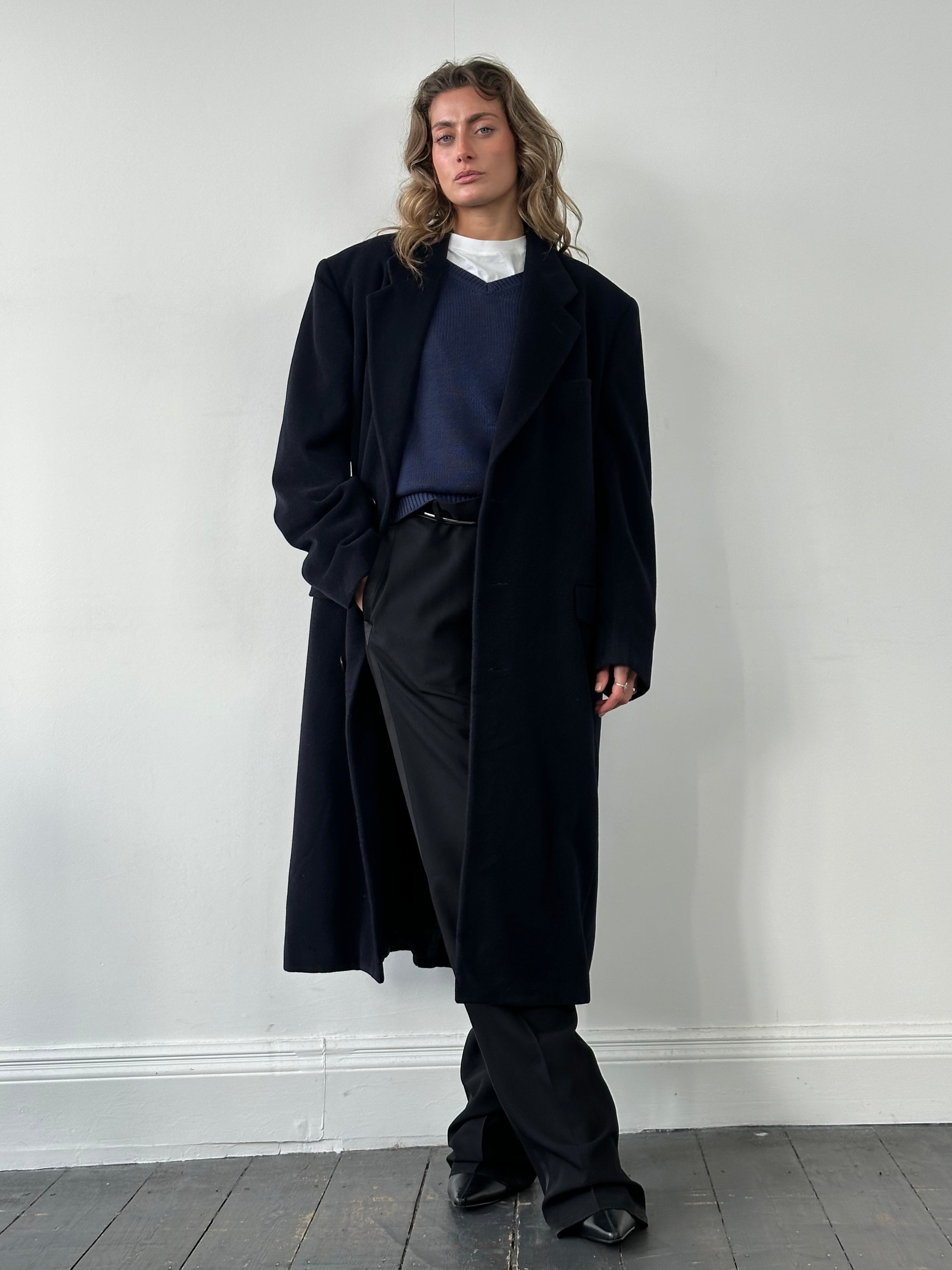 Giorgio Armani Le Collezioni pure wool single-breasted coat in XXL, displayed on a hanger, showcasing classic tailored style.