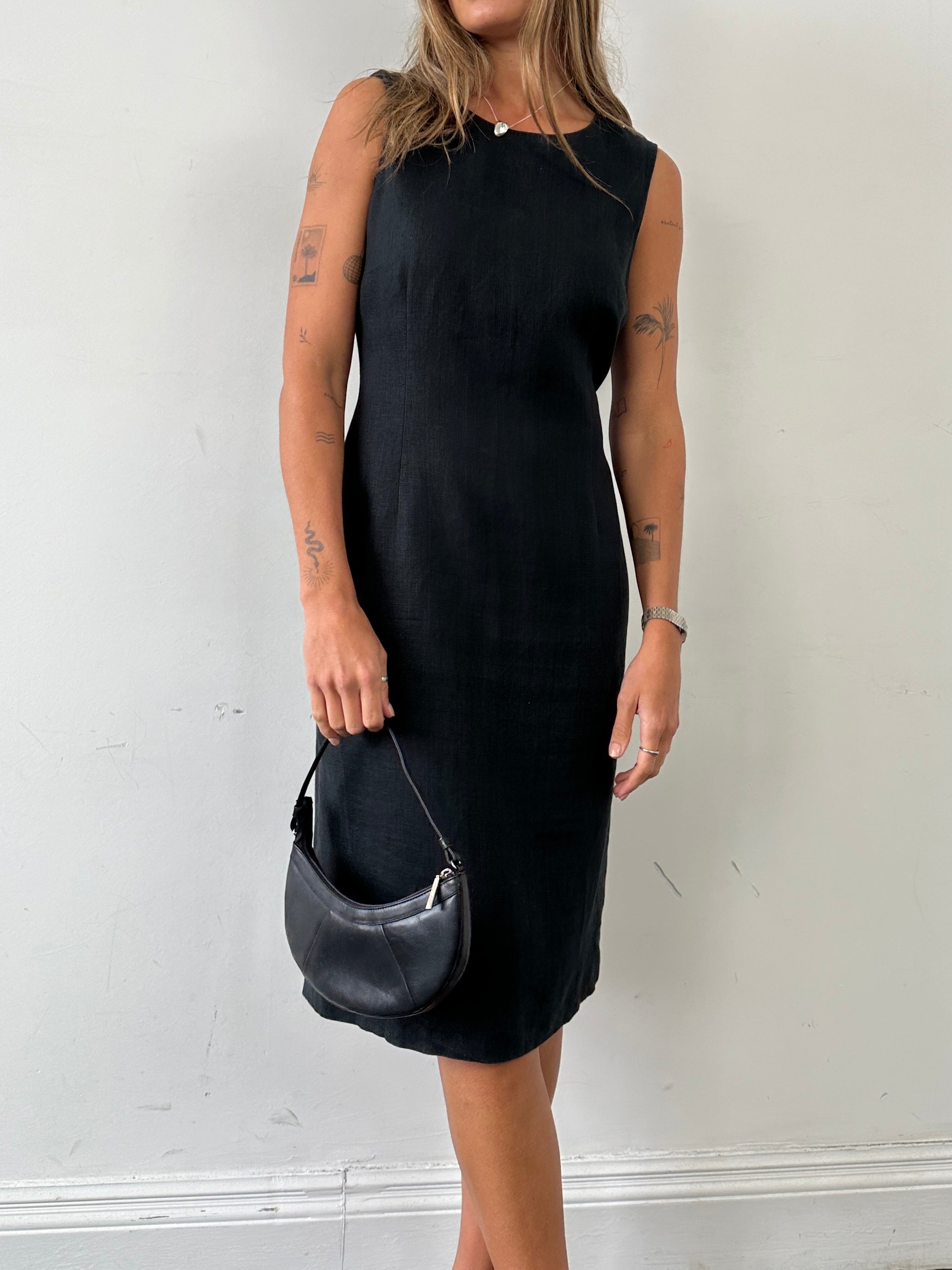 Jaeger pure linen midi sleeveless dress in white, featuring a relaxed fit and elegant design, perfect for warm weather.
