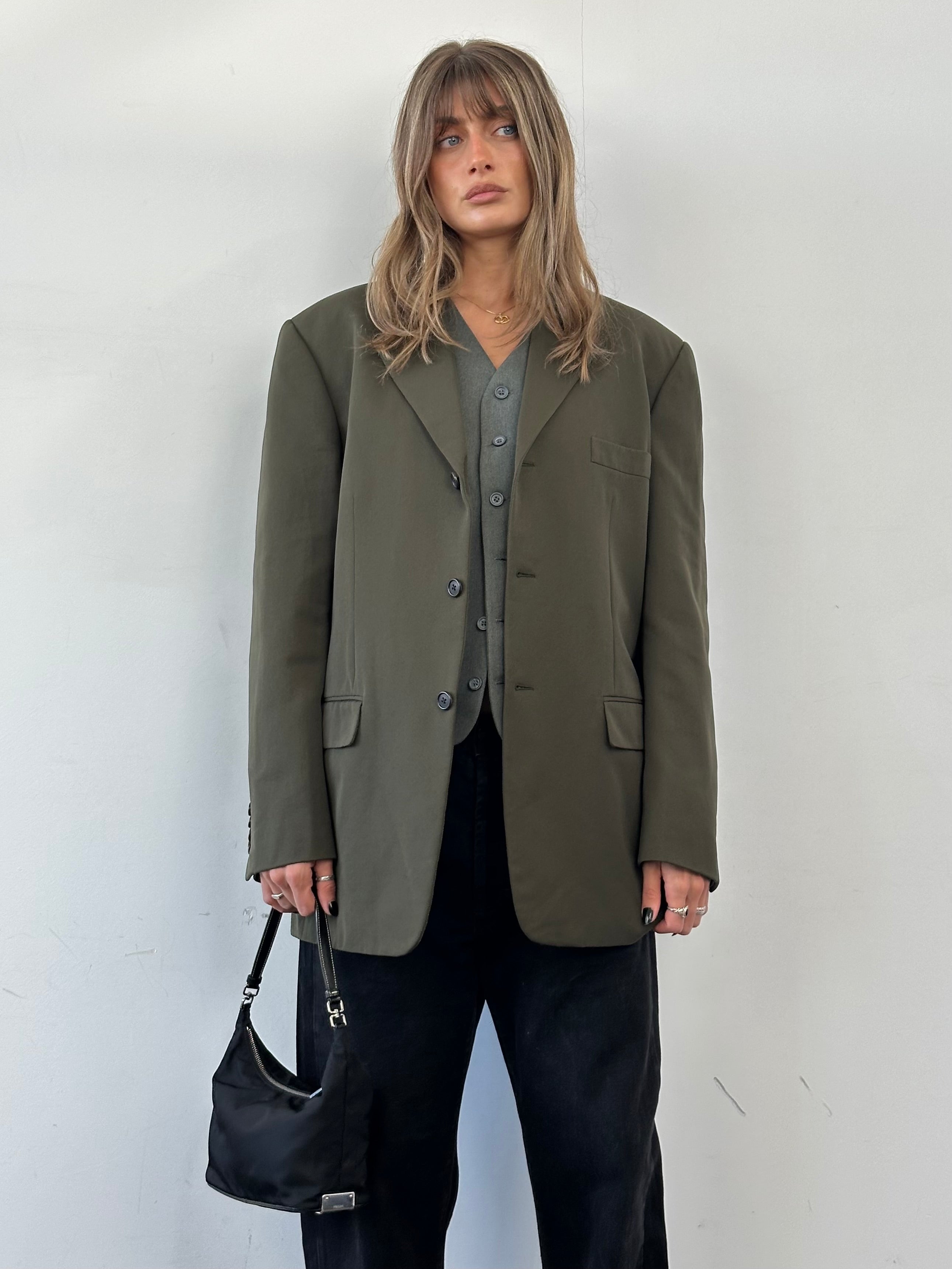 Prada nylon single-breasted blazer in size 44R/XL, shown in dark color, tailored fit with lapel collar and button closure.