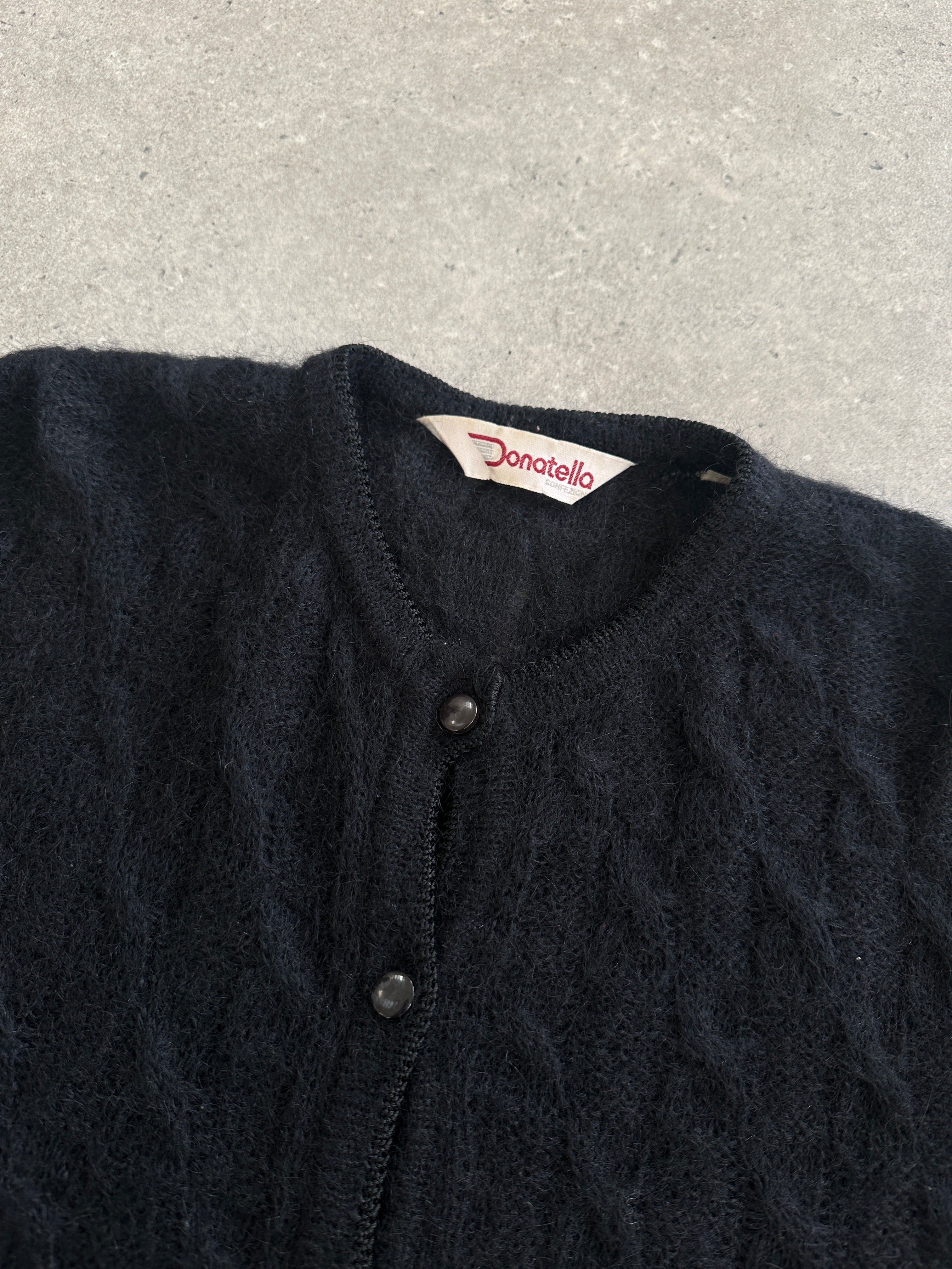 Vintage Italian 1990s mohair cardigan in M/L size, featuring a knitted design with a cozy, textured appearance.