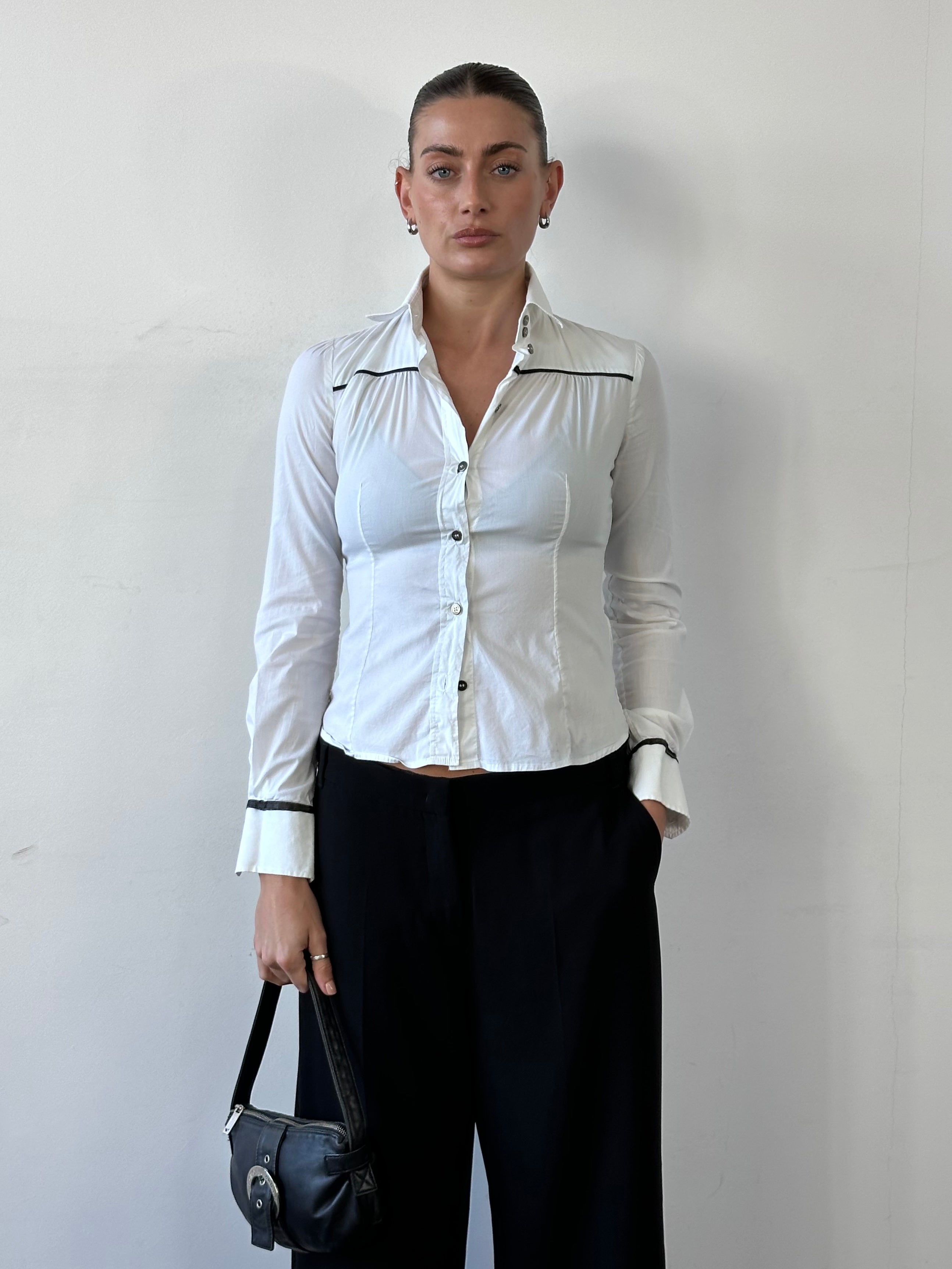 Dolce & Gabbana fitted cotton shirt in light color, size XS, displayed on a hanger with visible collar and button details.