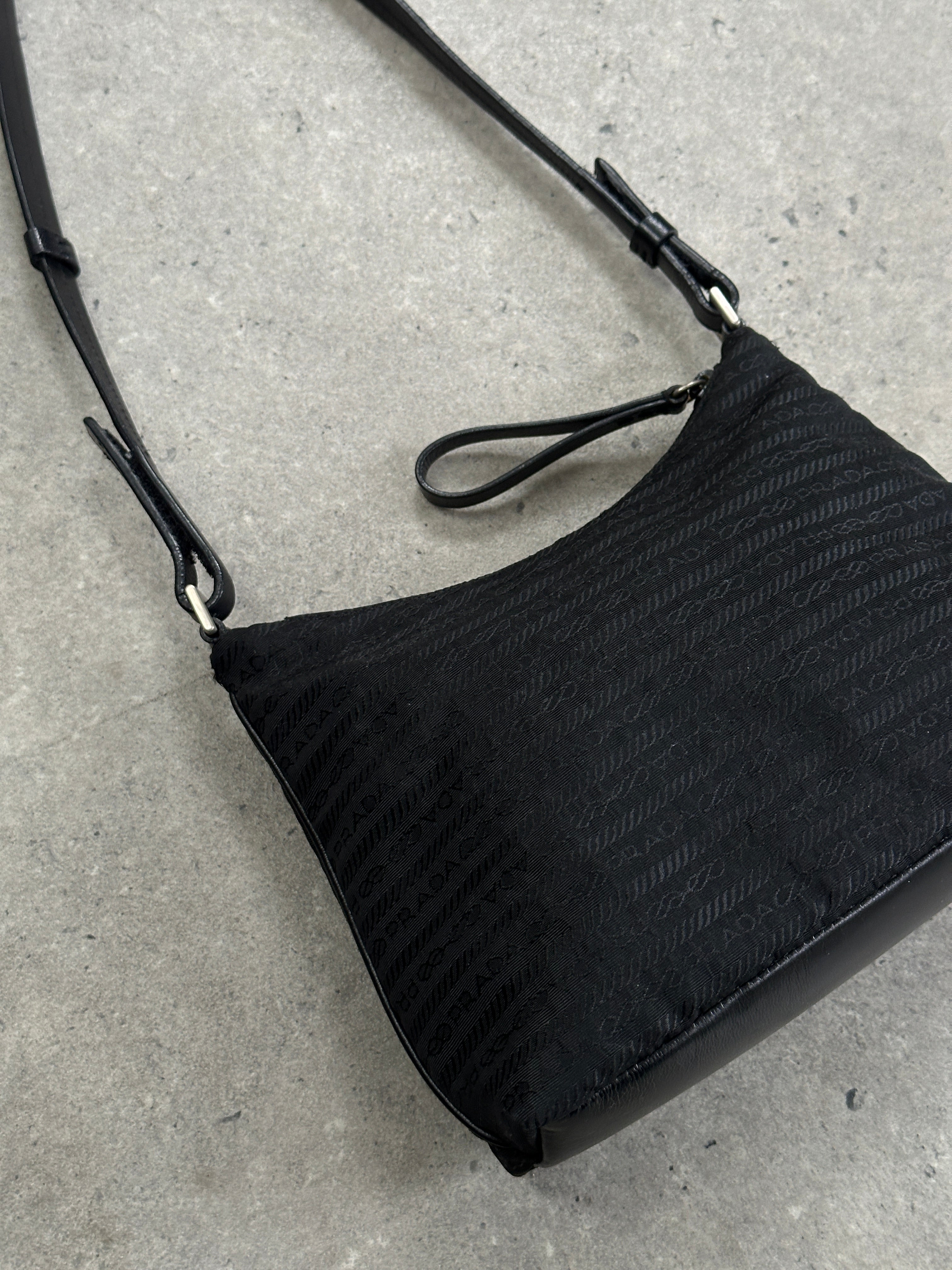 Prada nylon Tessuto monogram crossbody bag with adjustable strap and logo detail, lightweight and stylish for everyday use.