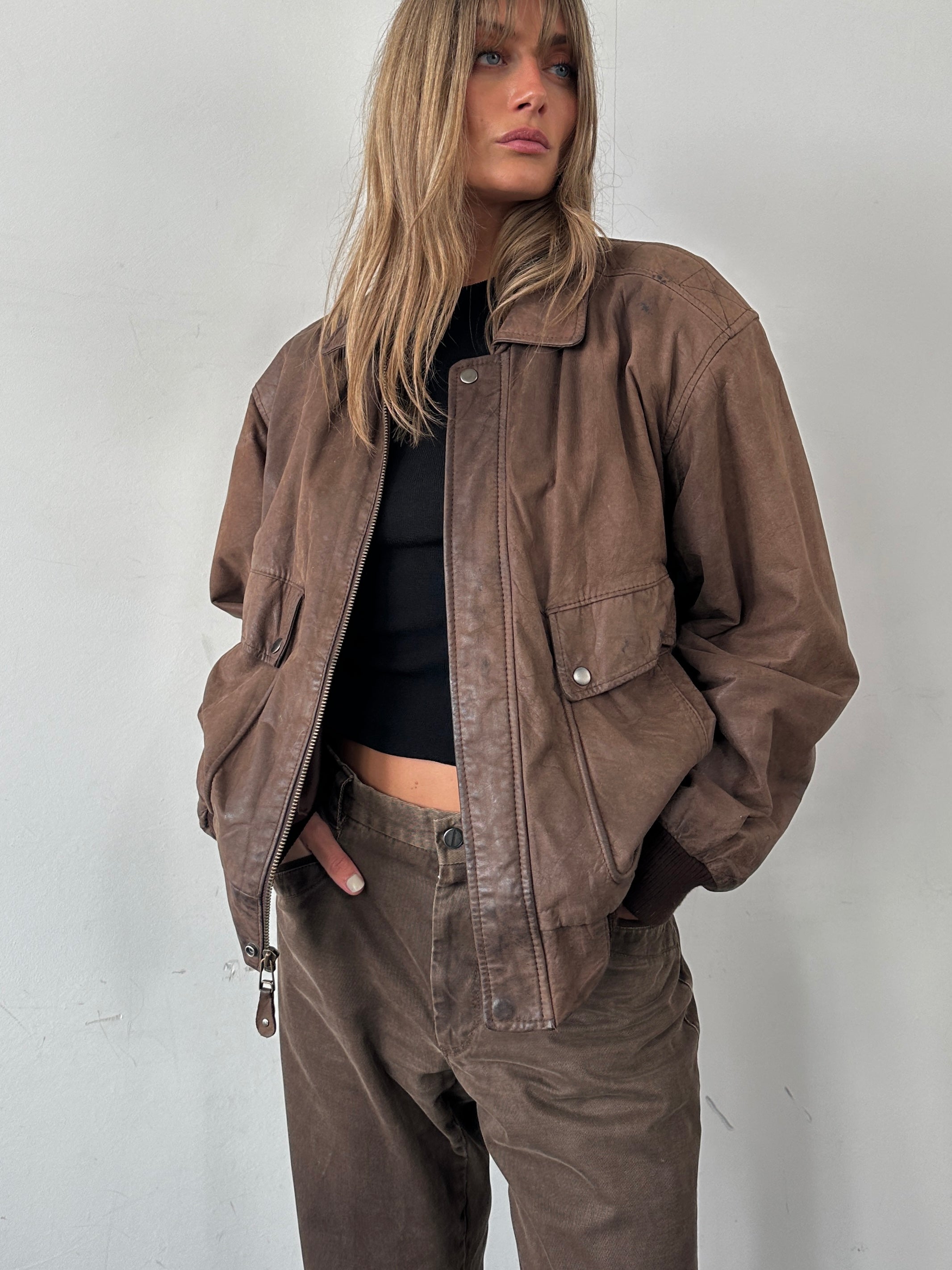 Vintage leather bomber jacket in size large, featuring classic design and detailed stitching, by Vintage.