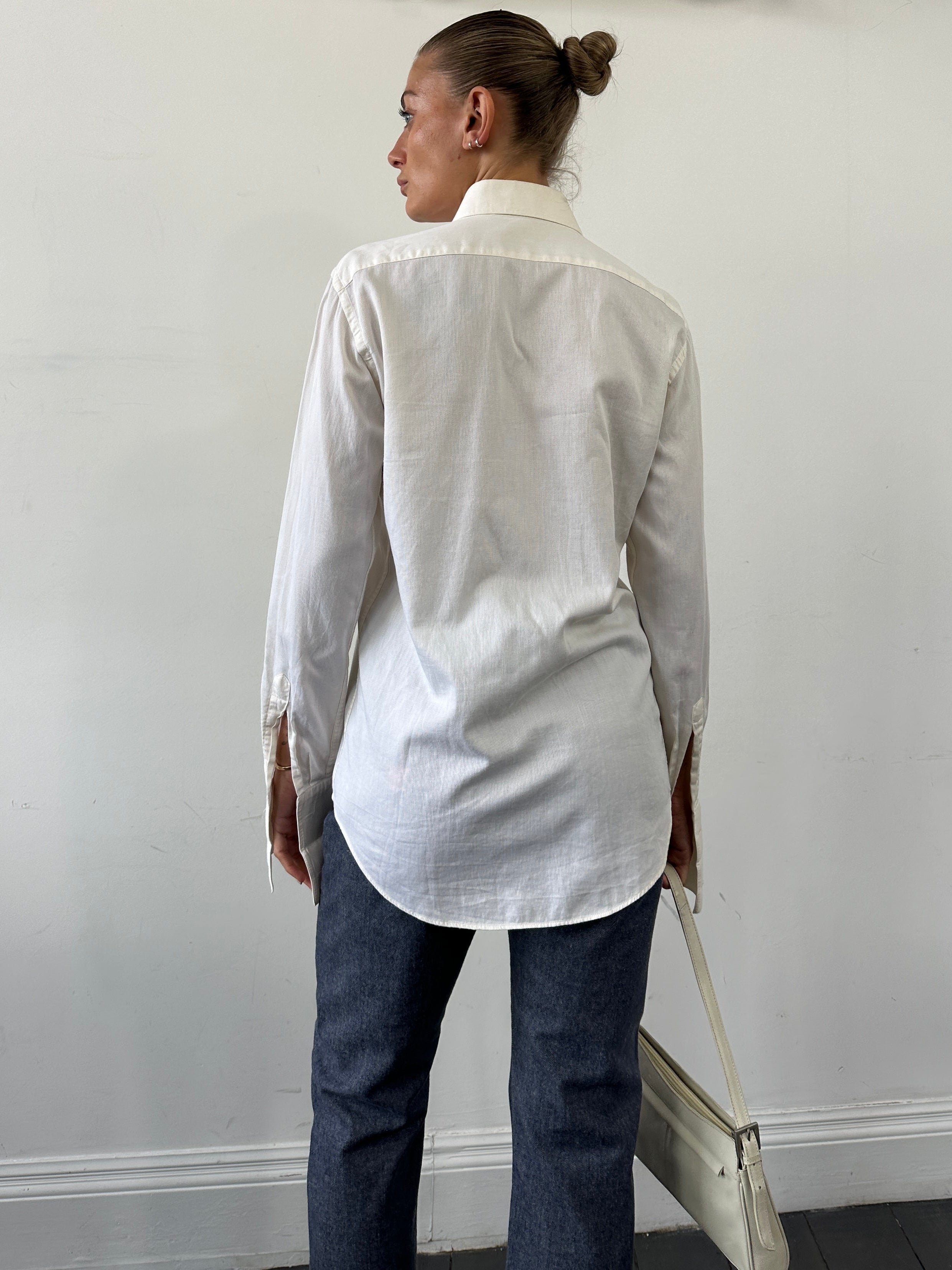 Pal Zileri pure cotton wing collar dress shirt in size M displayed on a hanger, featuring a classic white design and button-front.