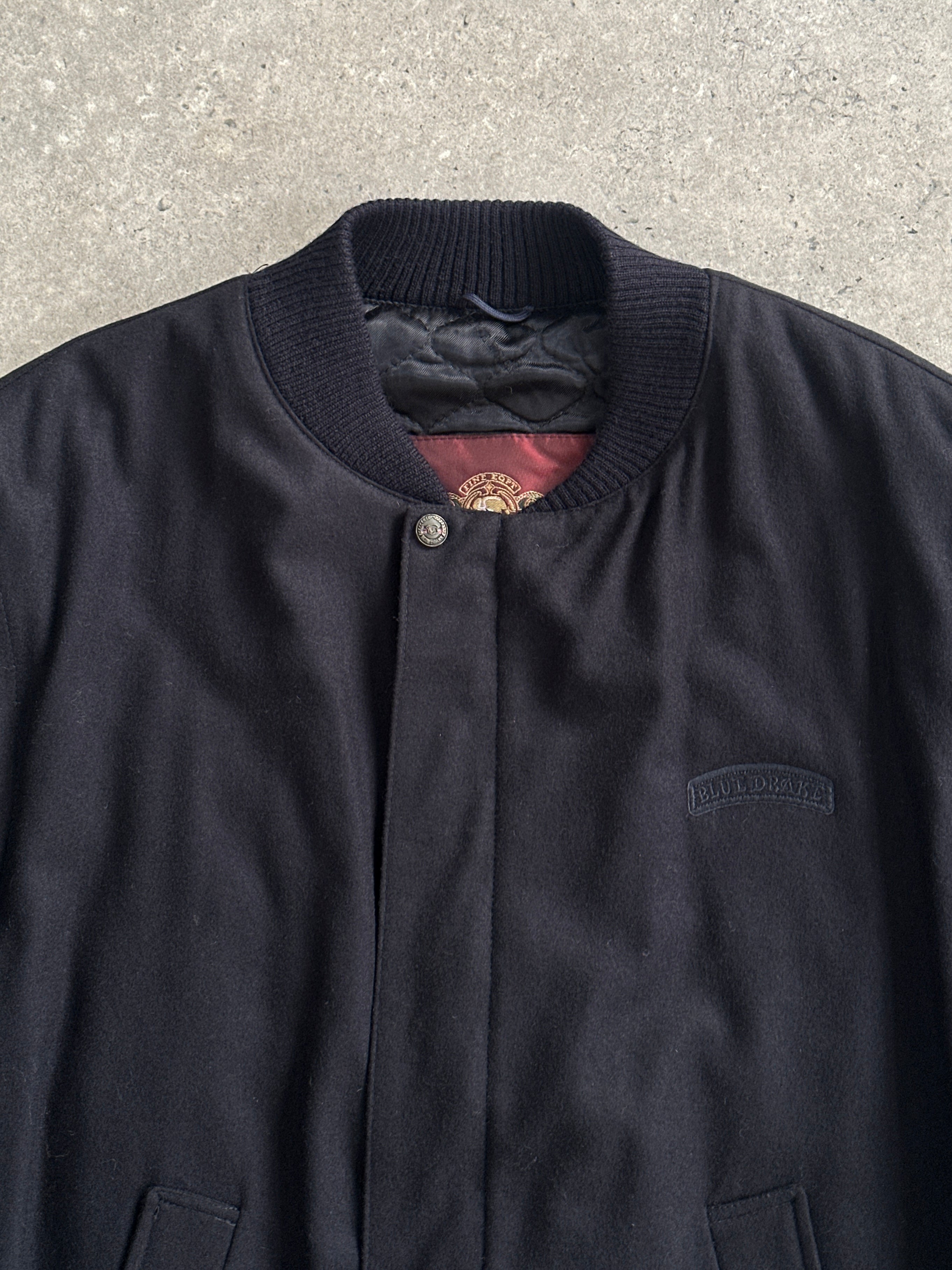 Vintage Italian vintage wool bomber jacket in size L, featuring classic design and textured wool fabric.