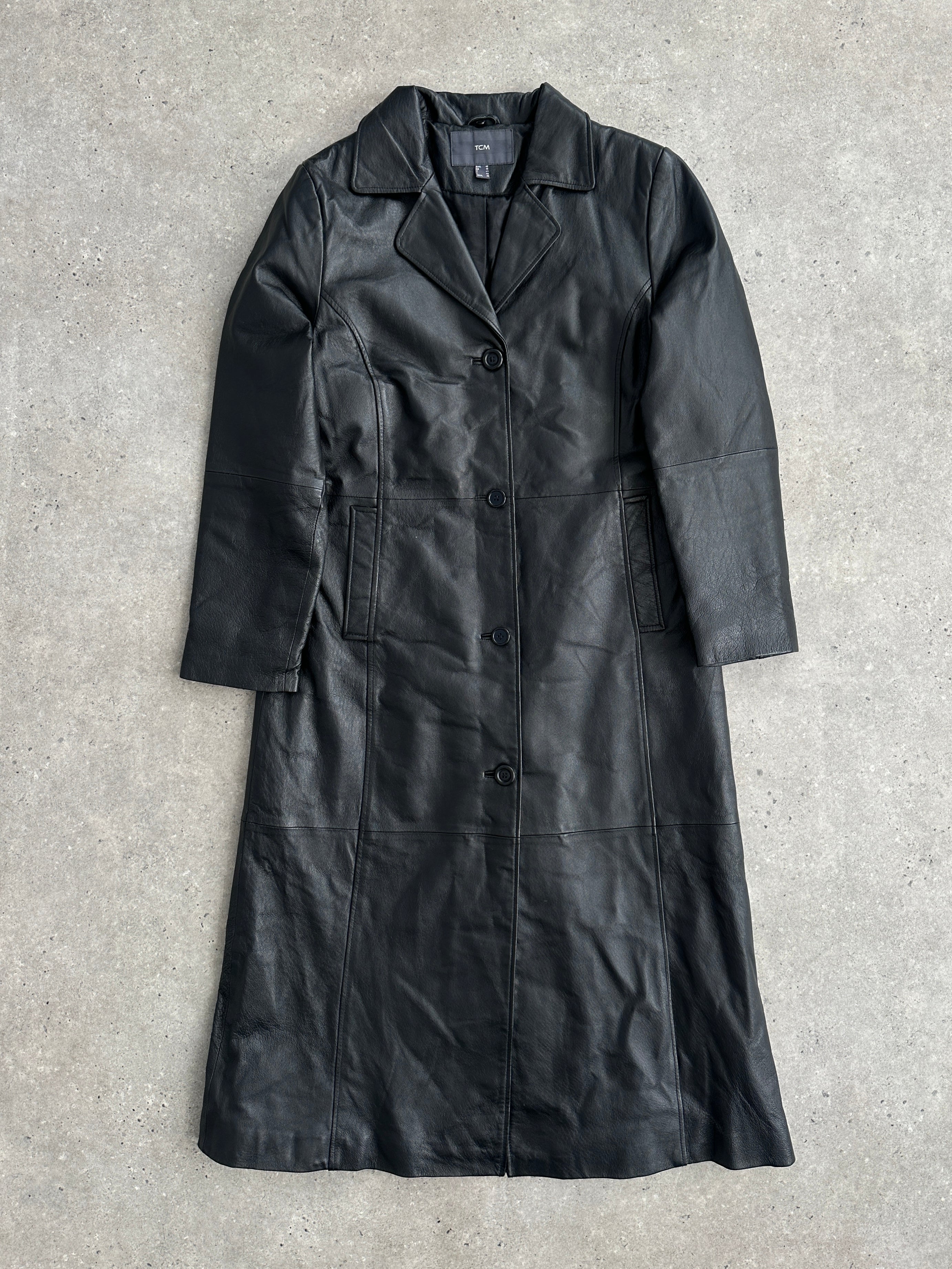 Vintage brand vintage leather trench coat, floor-length jacket in size M, shown hanging on a wooden hanger.
